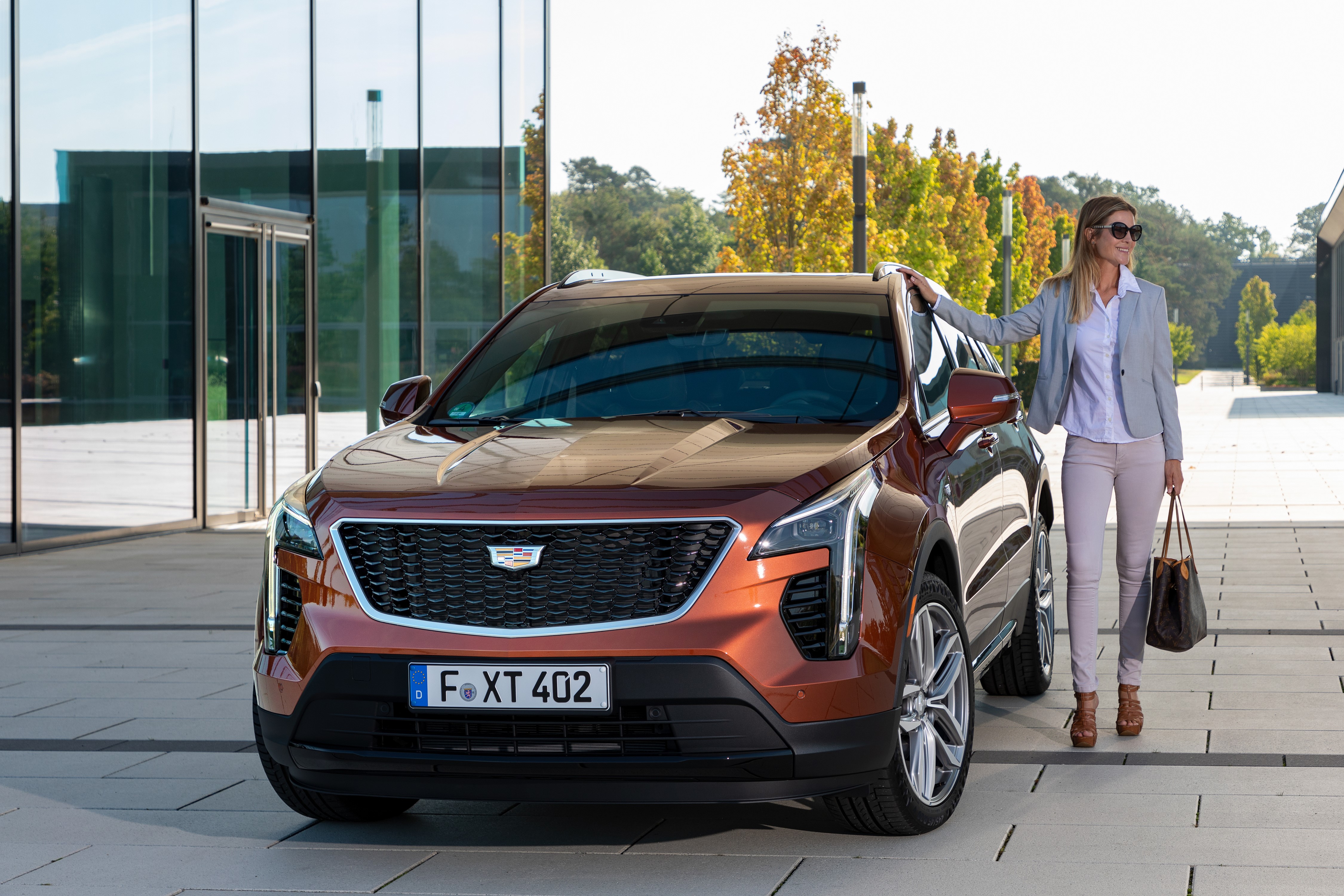 2020 Cadillac XT4 Crossover with Woman HD Wallpaper
