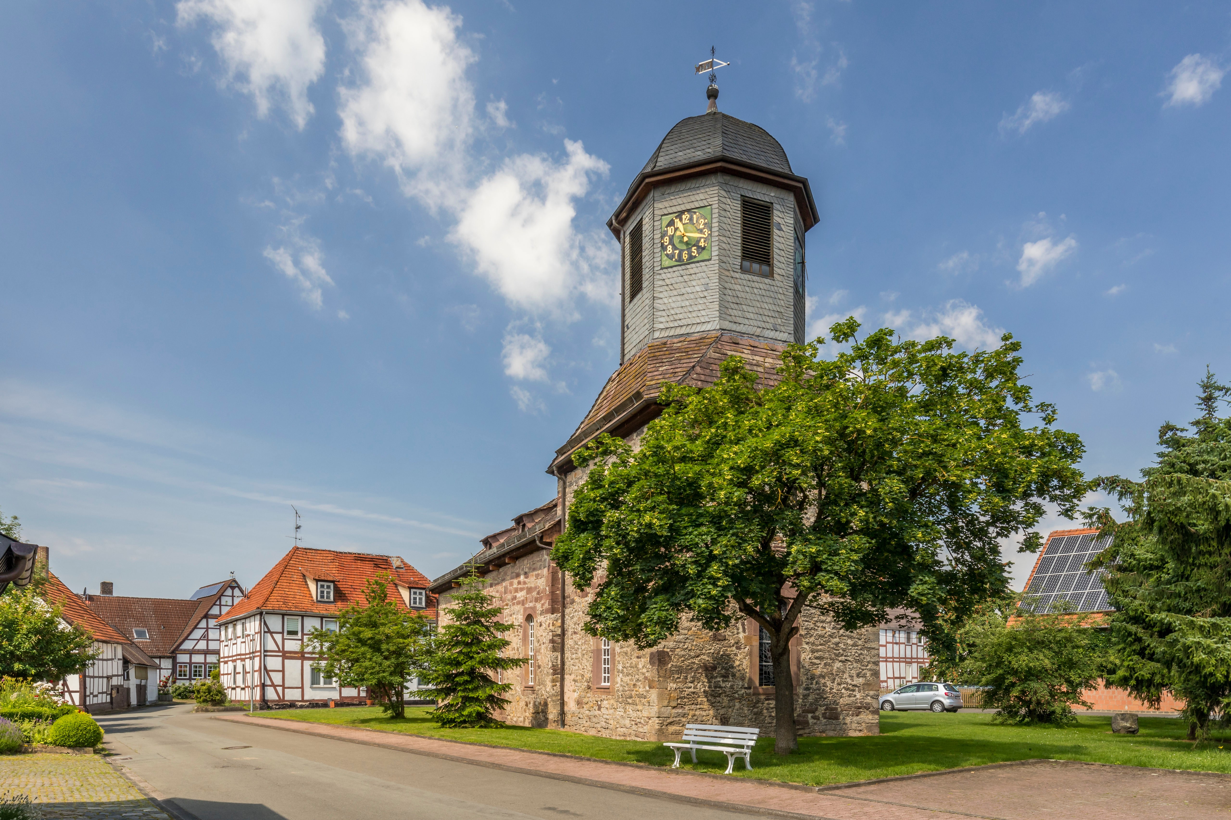 Church tower with clock in a German village HD Wallpaper
