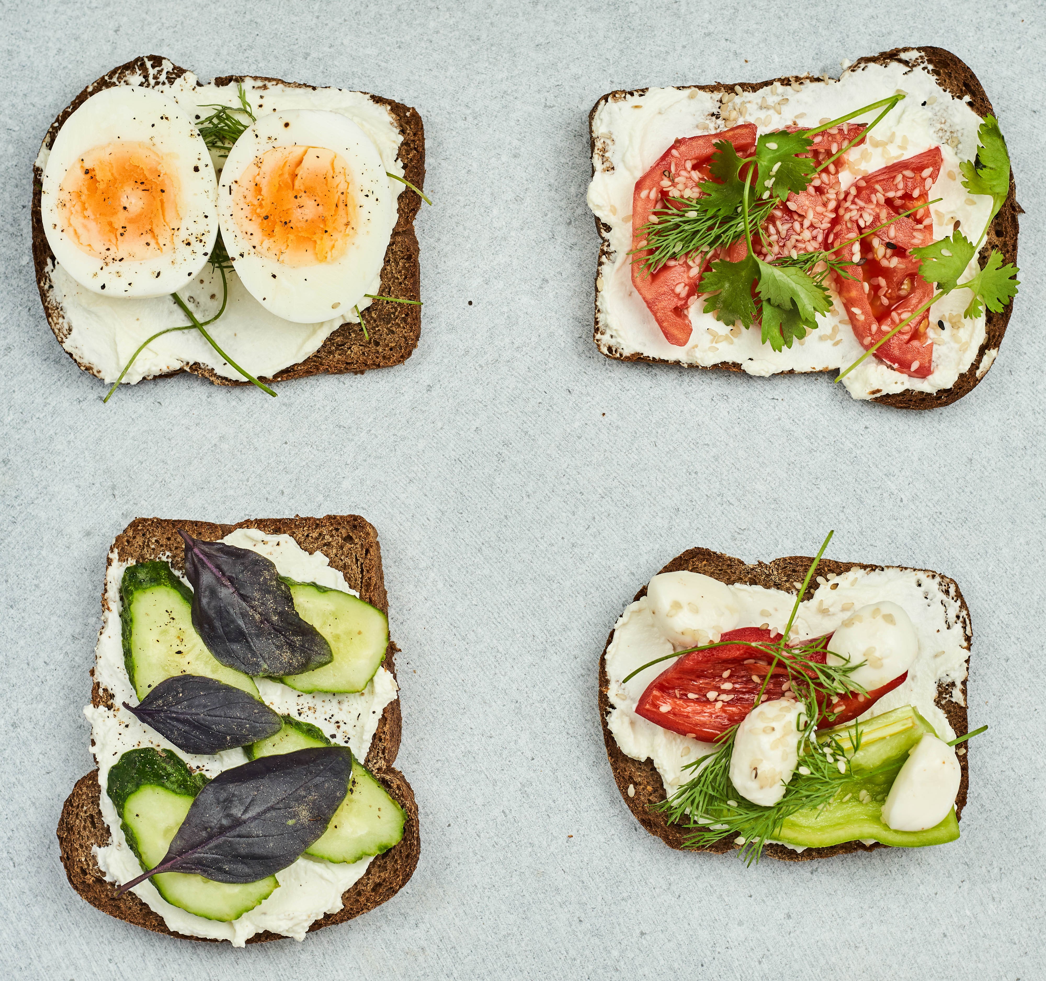 Four open-faced sandwiches with eggs, tomatoes, and cucumbers HD Wallpaper
