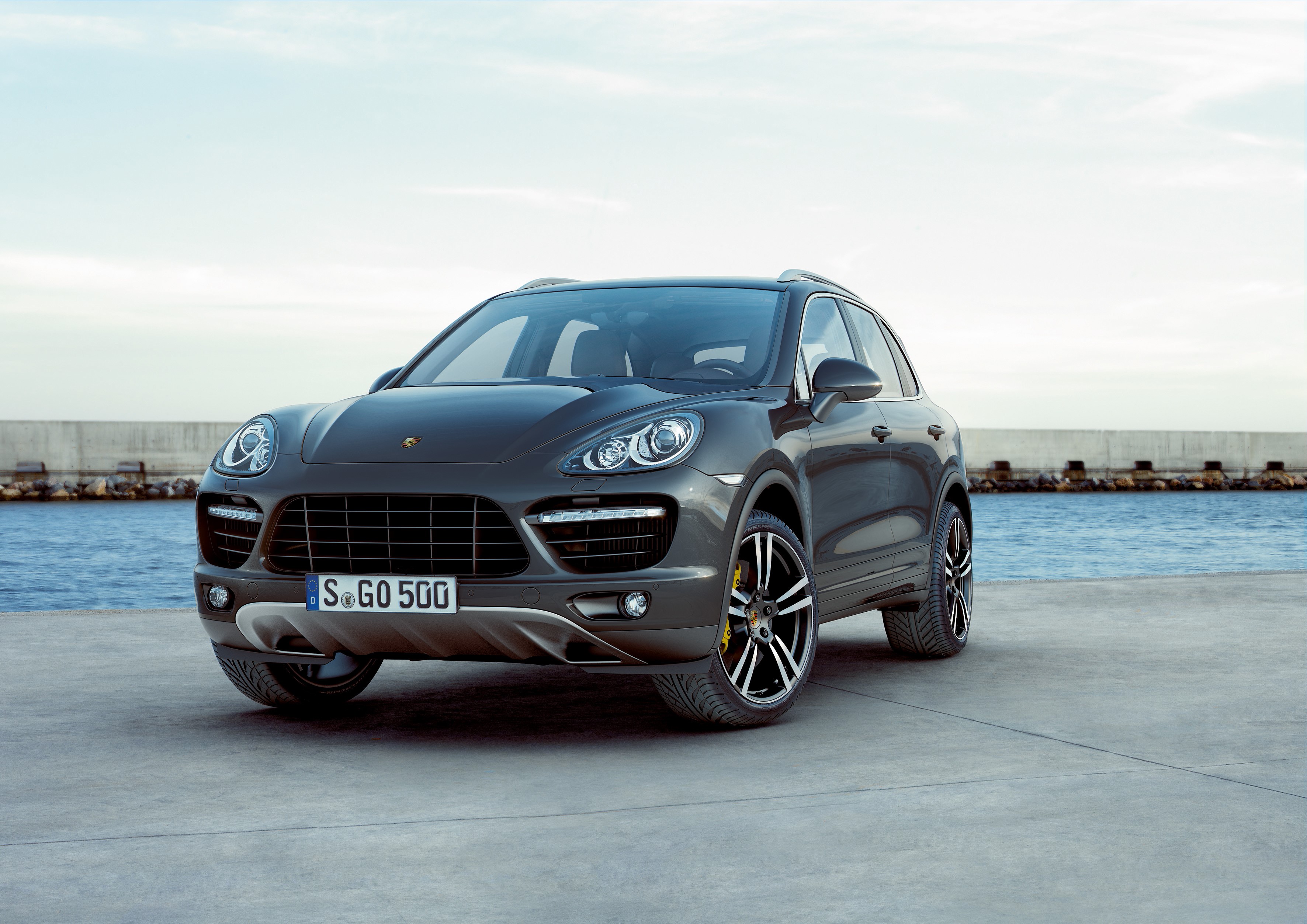 Grey Porsche Cayenne parked by the water HD Wallpaper