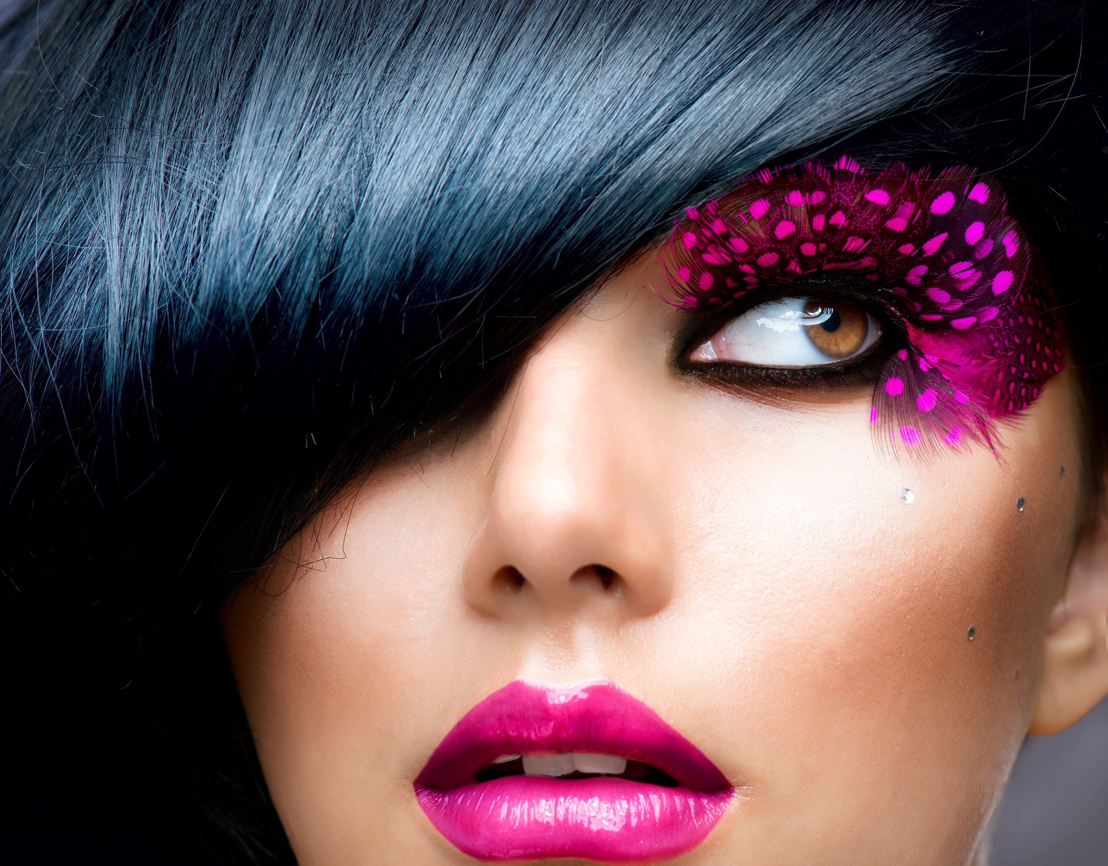 Closeup of a woman with dramatic makeup HD Wallpaper