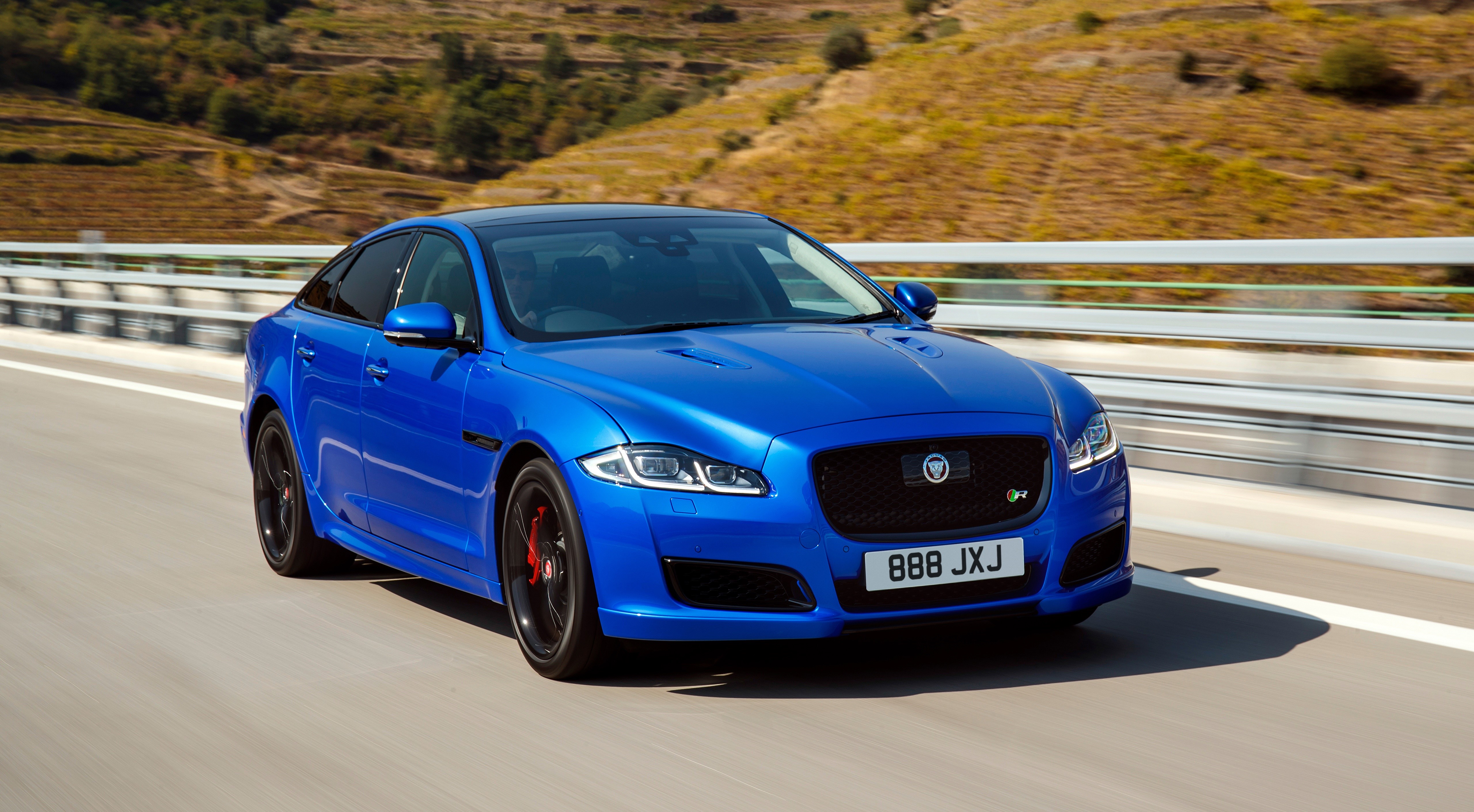 Blue 2017 Jaguar XJR575 Sedan on a Road HD Wallpaper