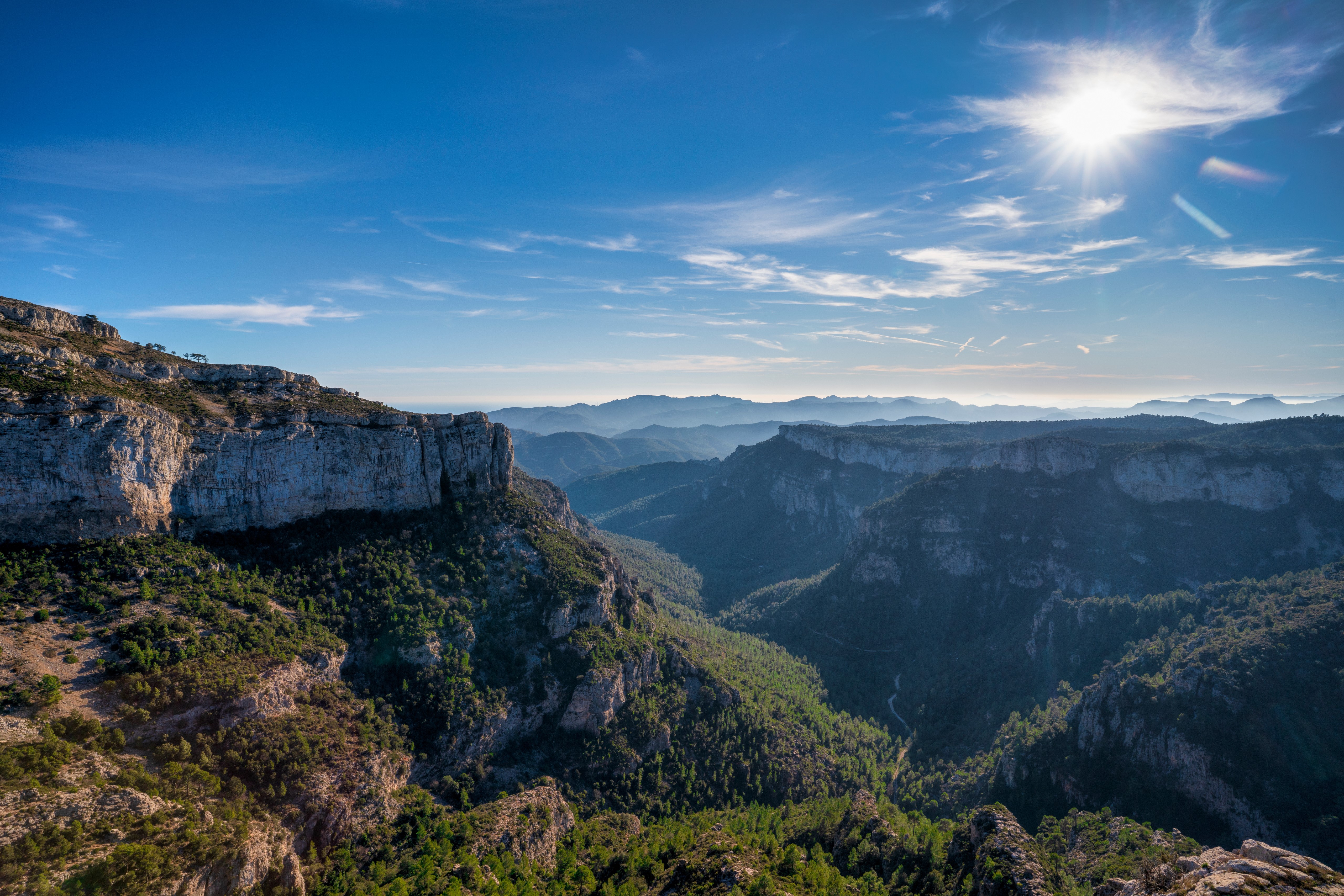 Mountains and valleys in Catalonia, Spain under a bright sun HD Wallpaper