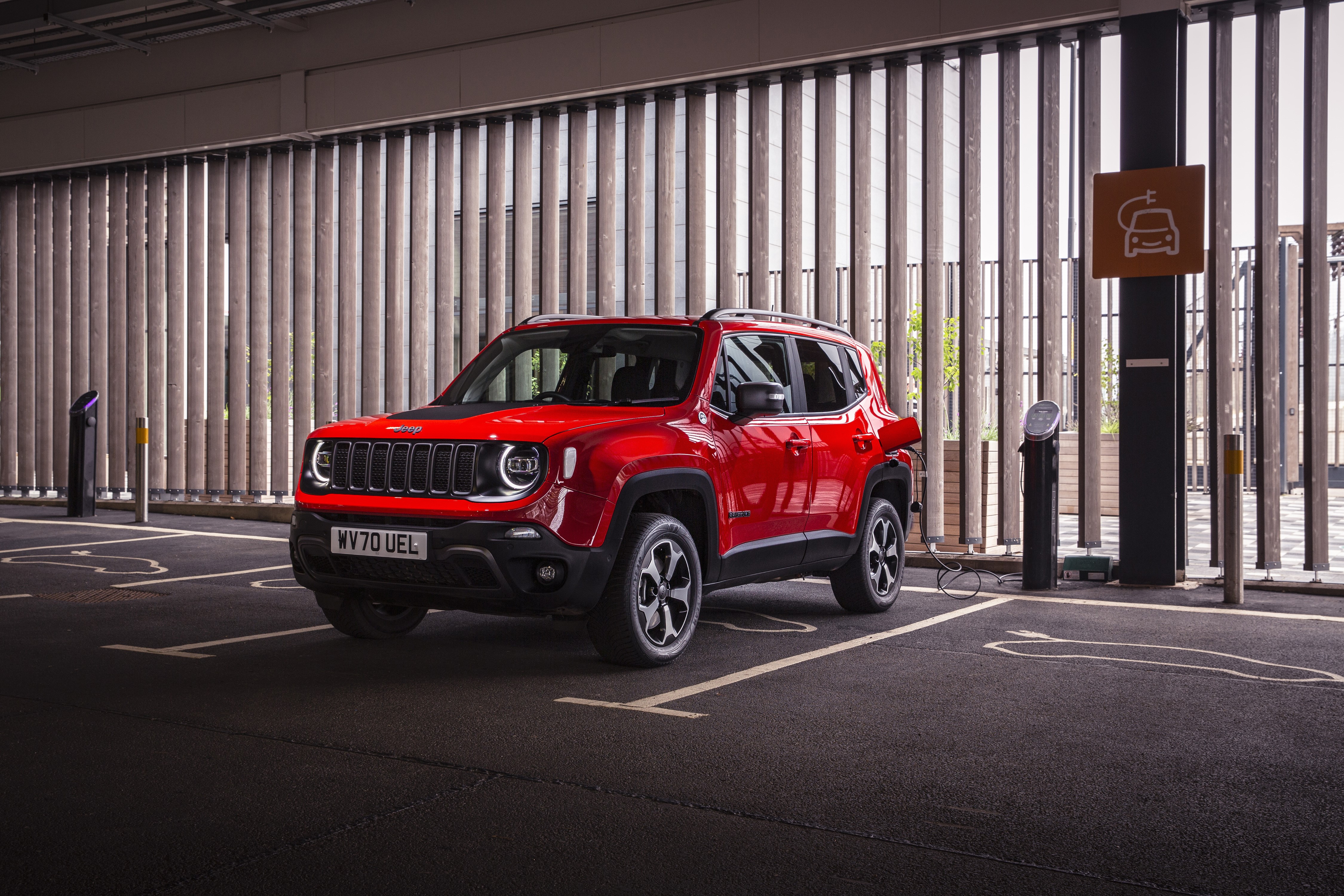 Red Jeep Renegade Trailhawk 4xe charging HD Wallpaper