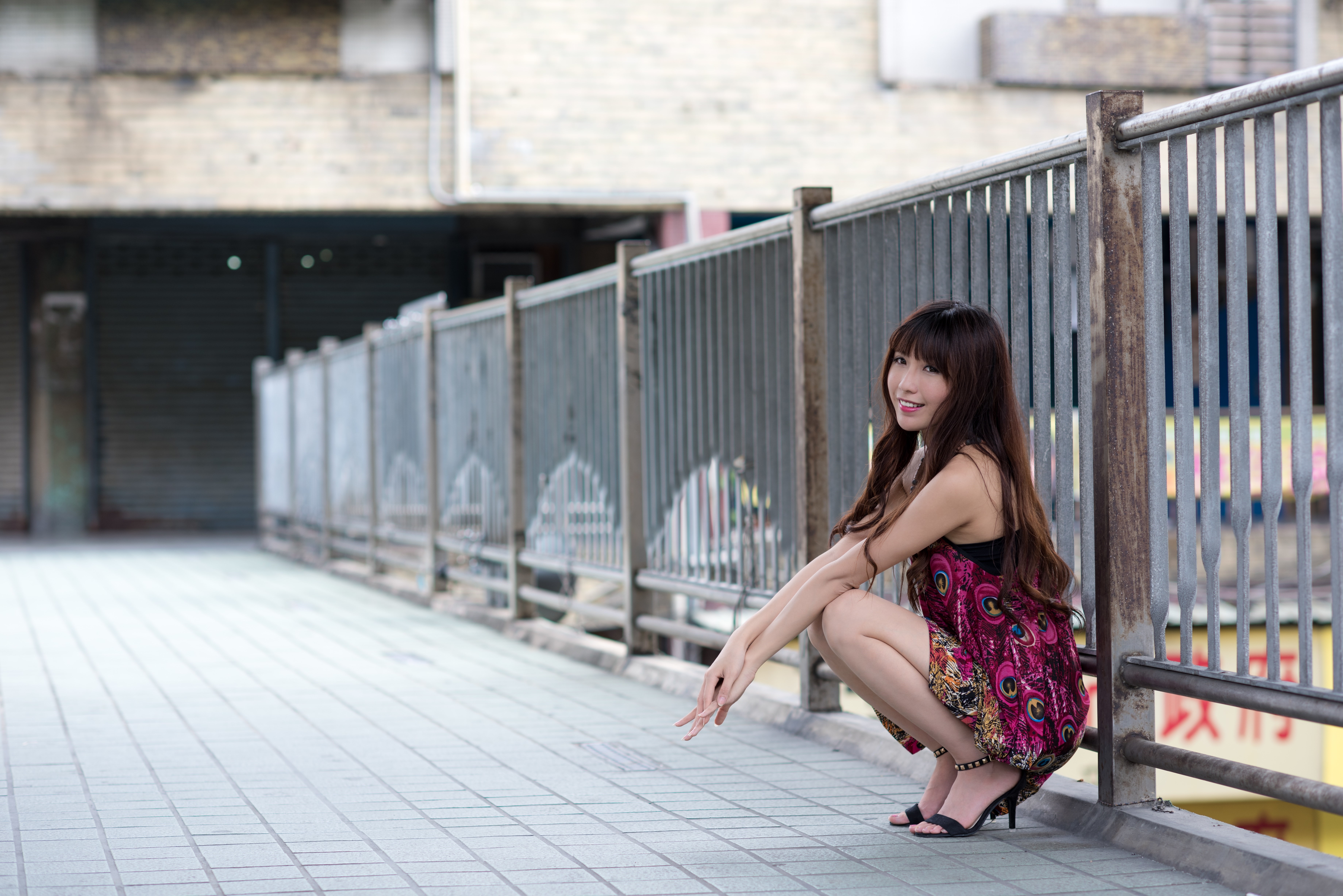 4K Asian Woman Sitting by Fence HD Wallpaper