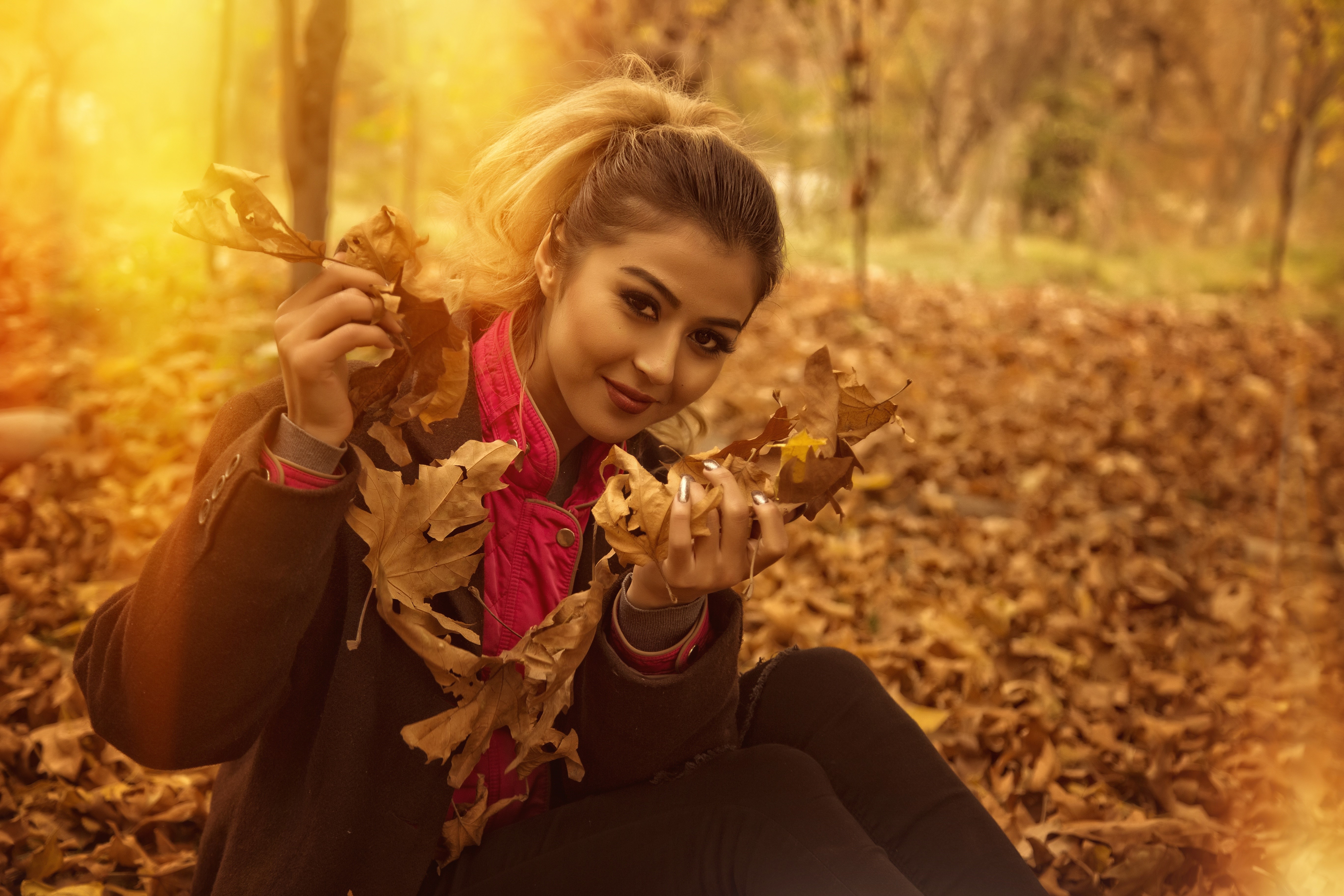 Woman in Autumn Foliage HD Wallpaper