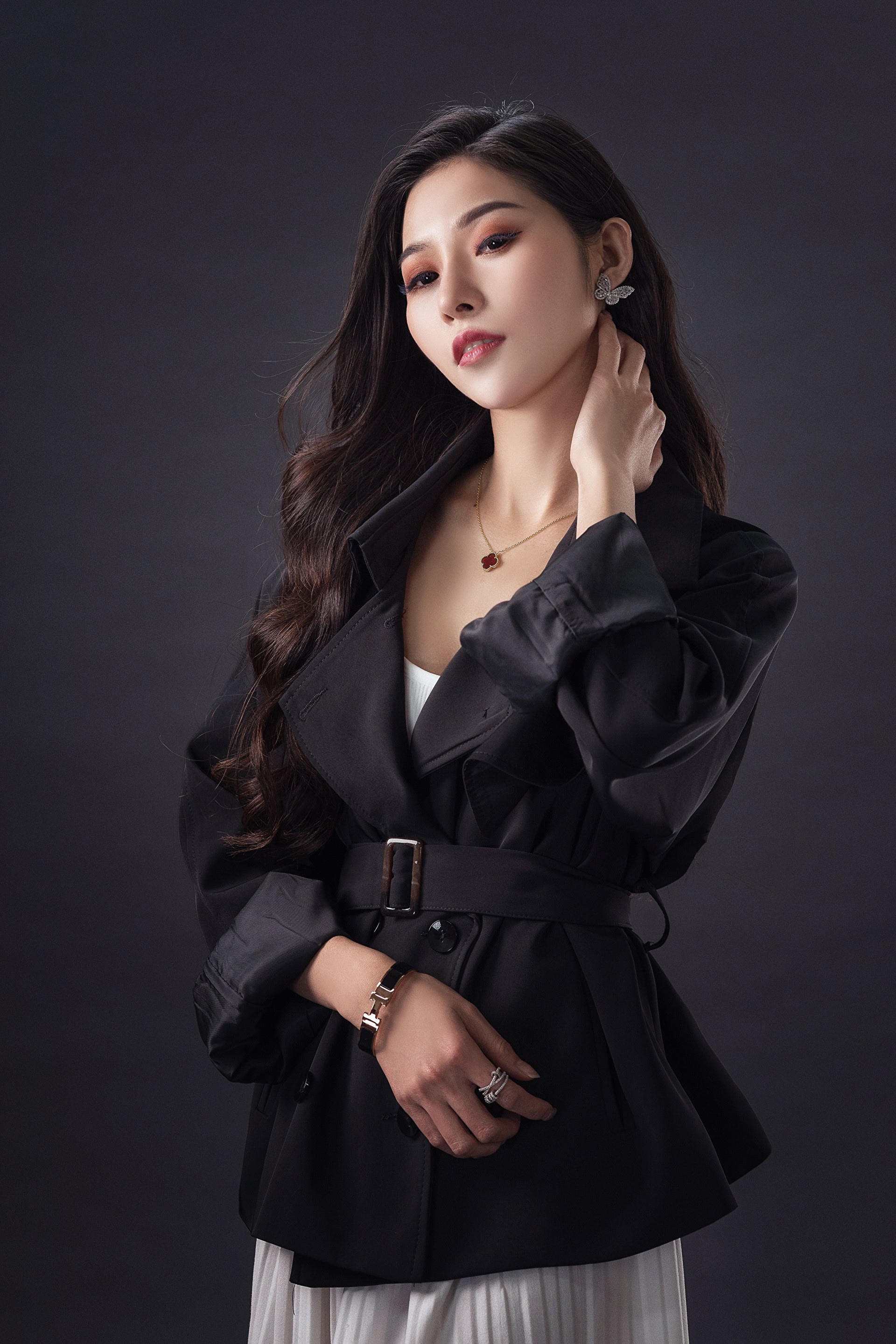 Asian woman wearing a black trench coat and jewelry HD Phone Wallpaper