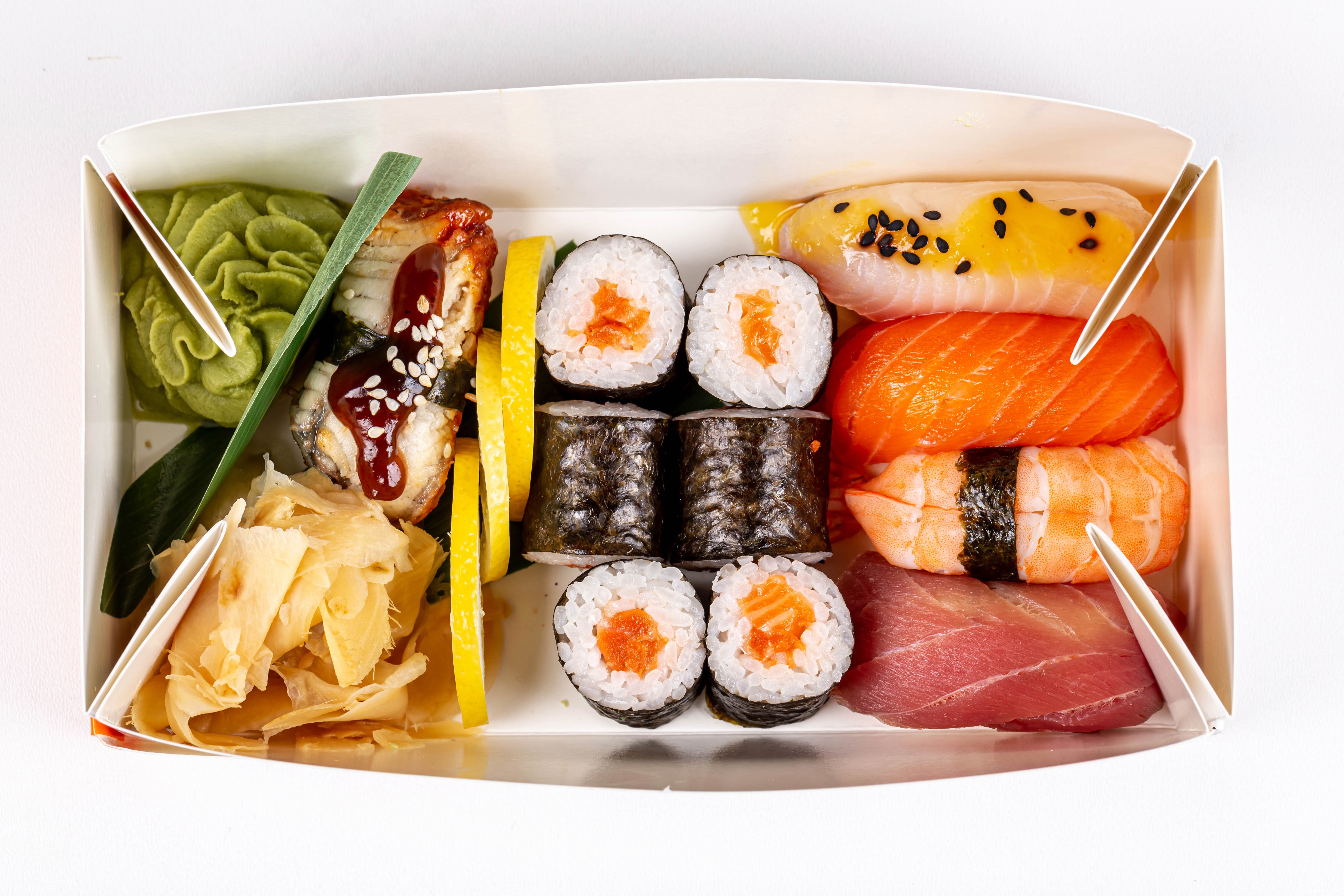 Sushi assortment in a box with wasabi and ginger HD Wallpaper