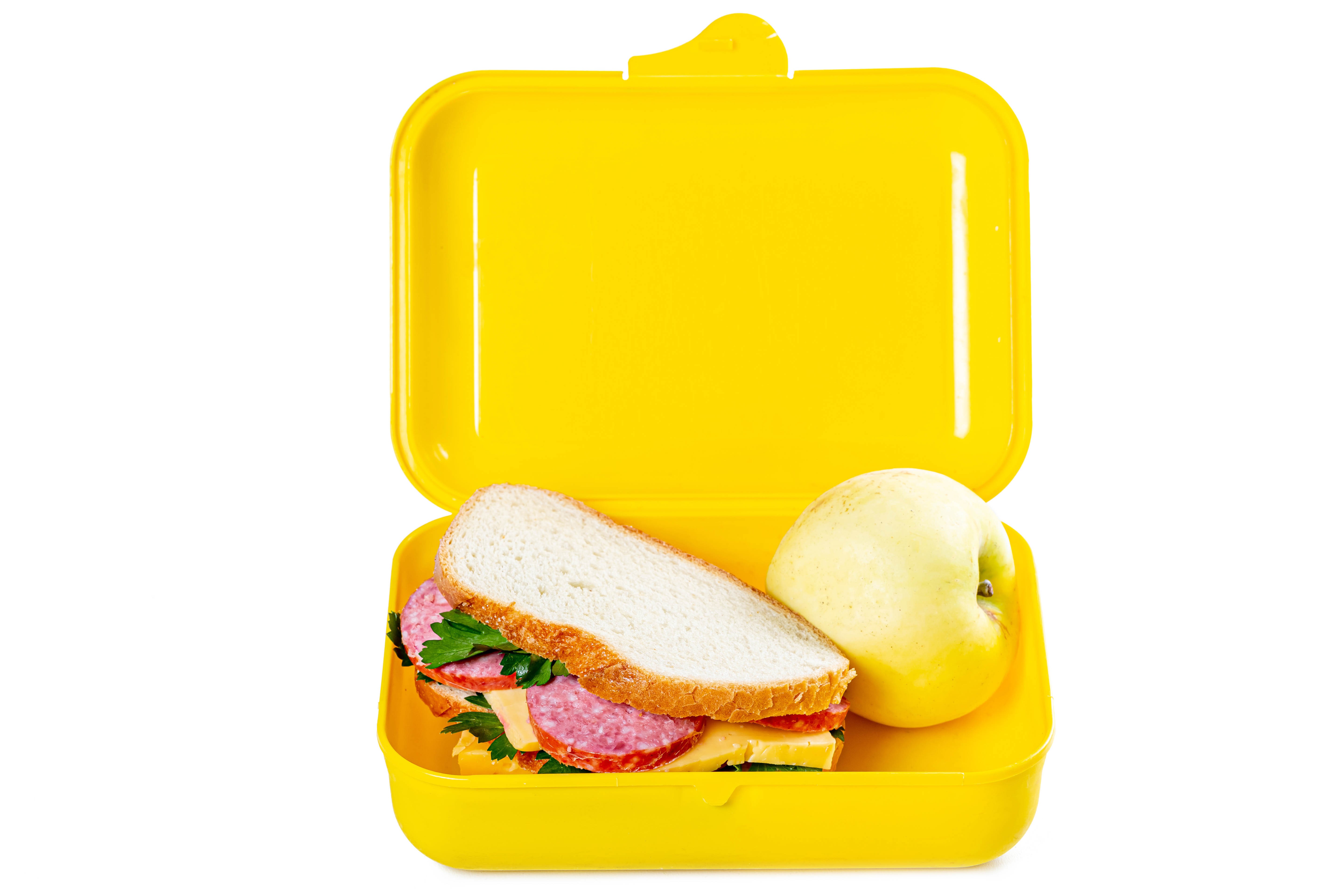 Sandwich and apple in a yellow lunch box HD Wallpaper