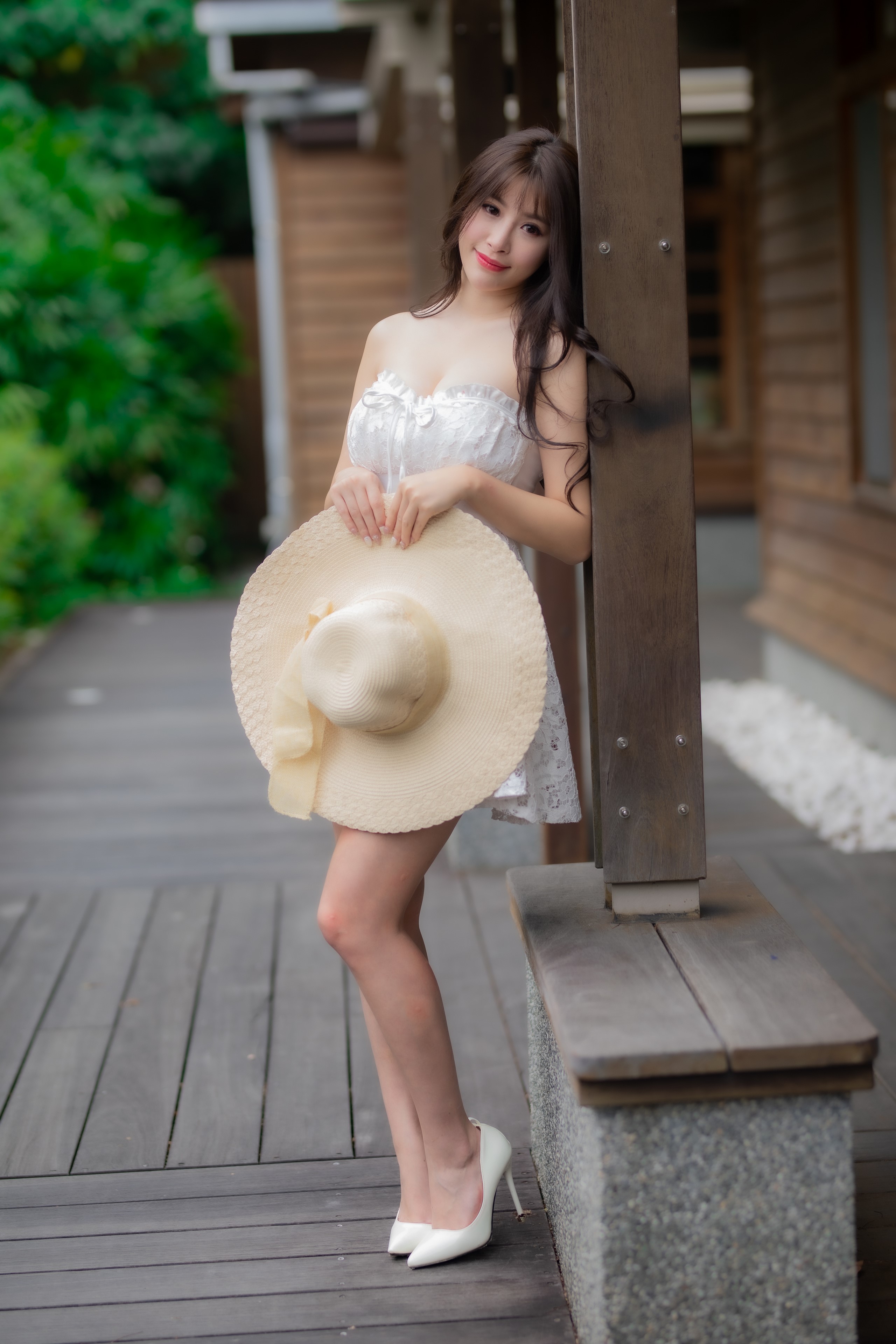 Asian woman in white dress holding a hat HD Phone Wallpaper