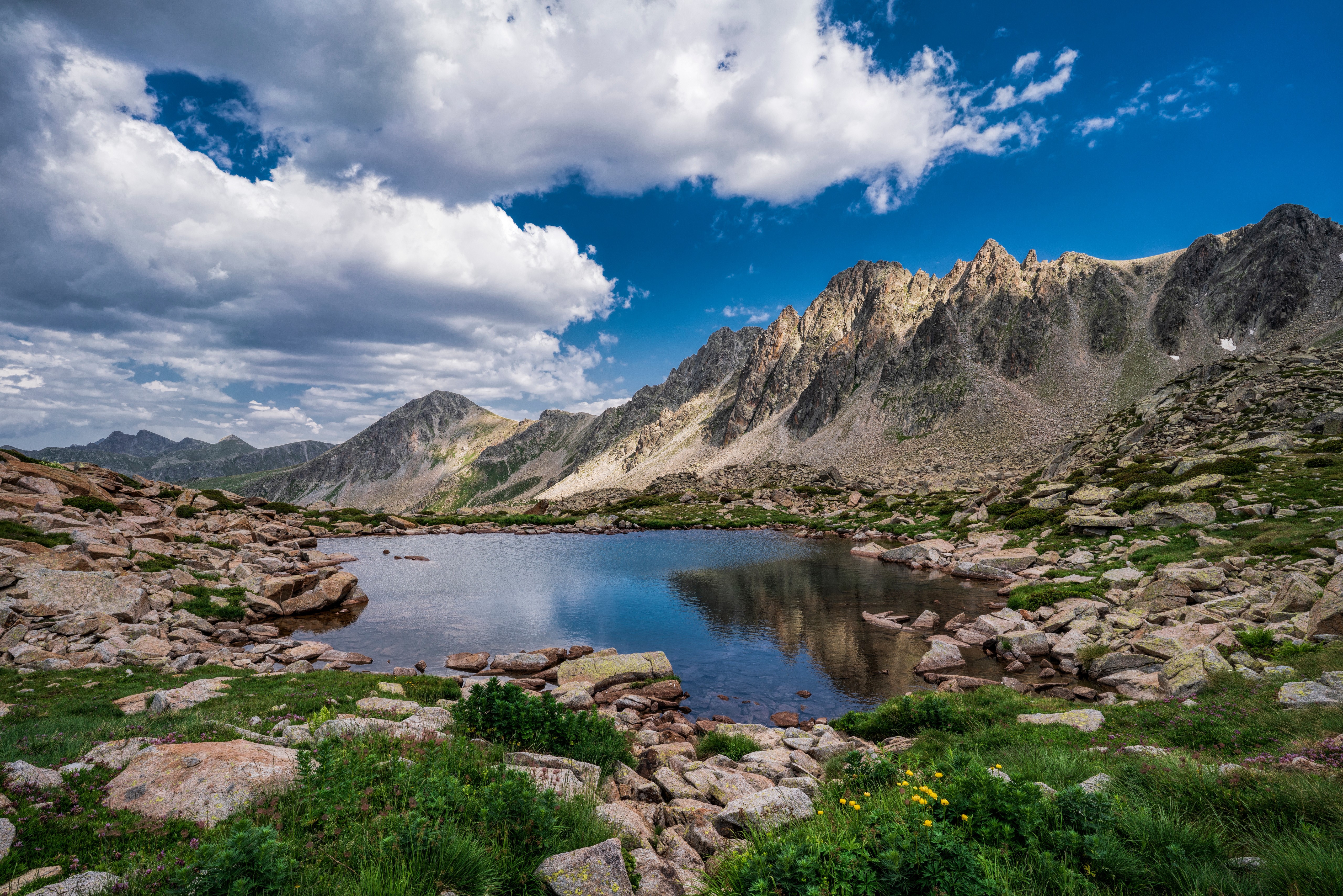 Lake Pessons in Andorra Mountains with Rocky Shoreline HD Wallpaper