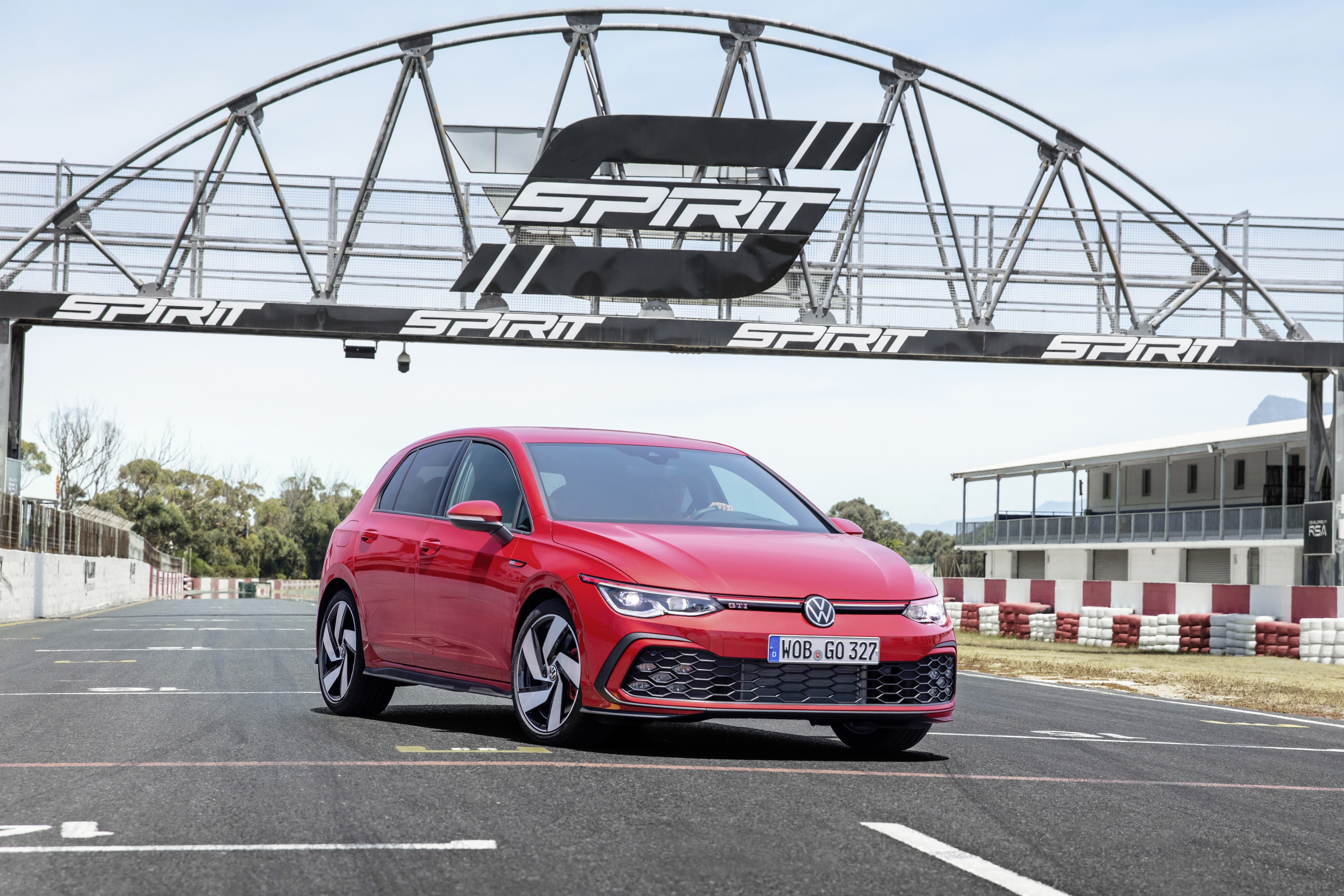 Red 2020 Volkswagen Golf GTI on a Race Track HD Wallpaper