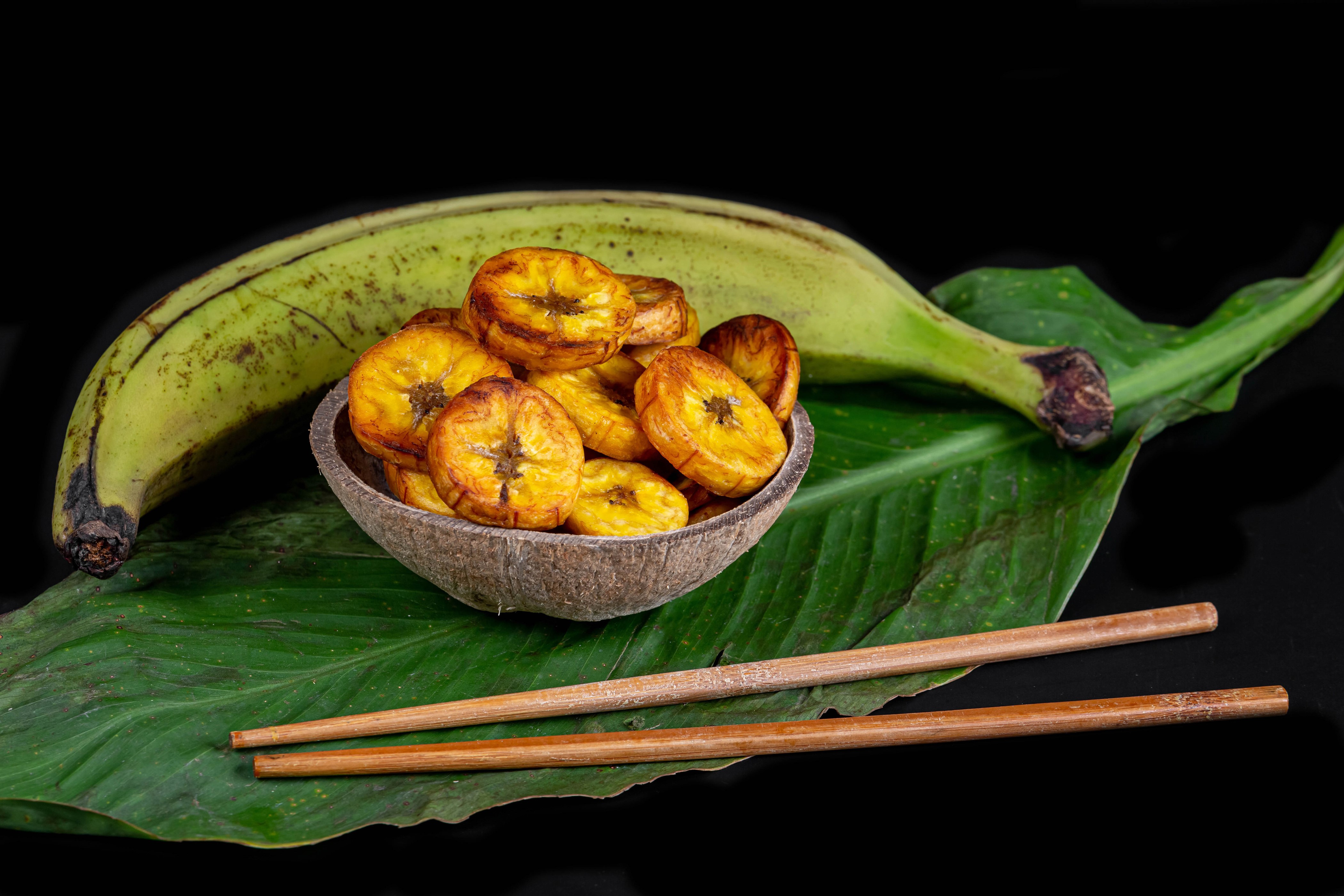 Fried Plantain Chips in Coconut Bowl with Plantain and Chopsticks HD Wallpaper