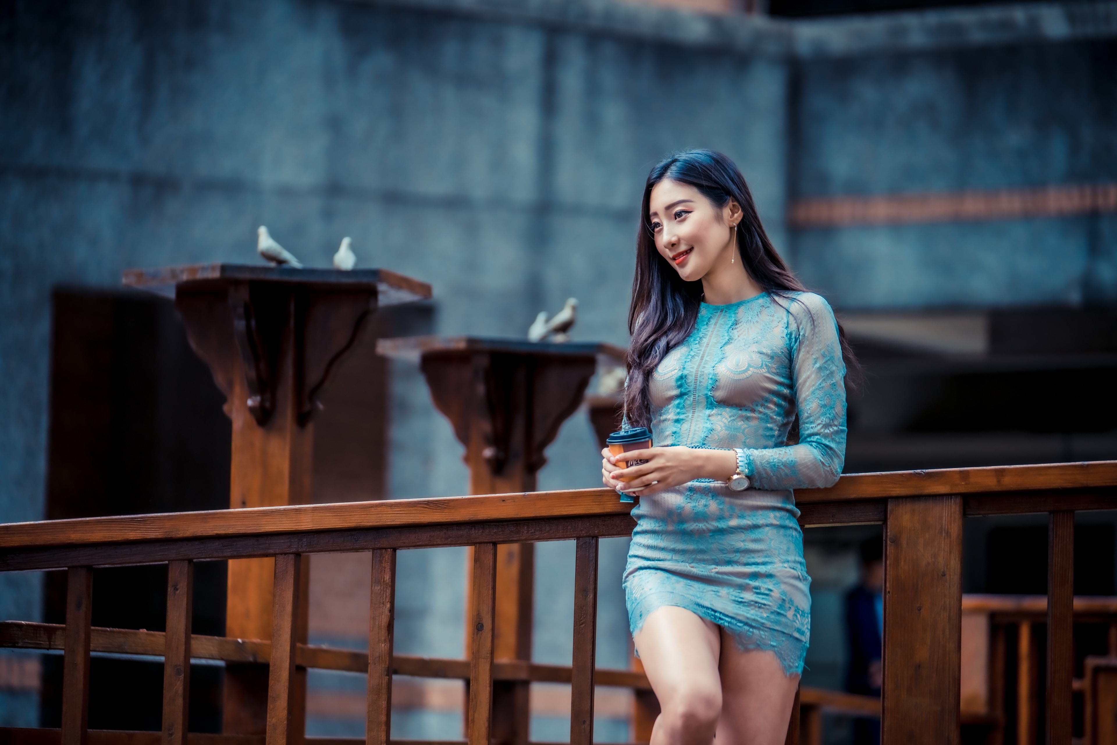 Asian woman in a blue dress holding a coffee cup HD Wallpaper