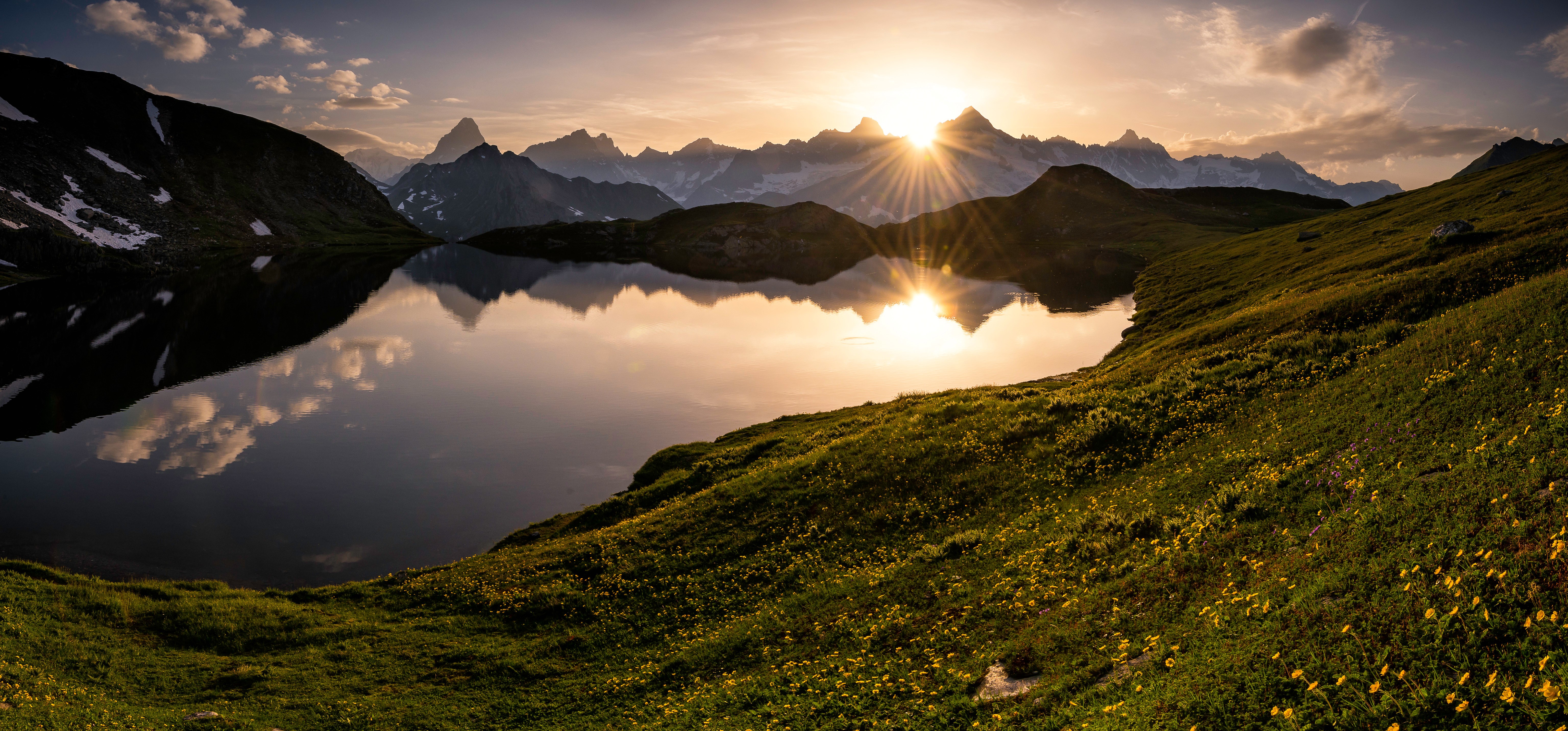 Sunset over a mountain lake in Valais, Switzerland HD Wallpaper