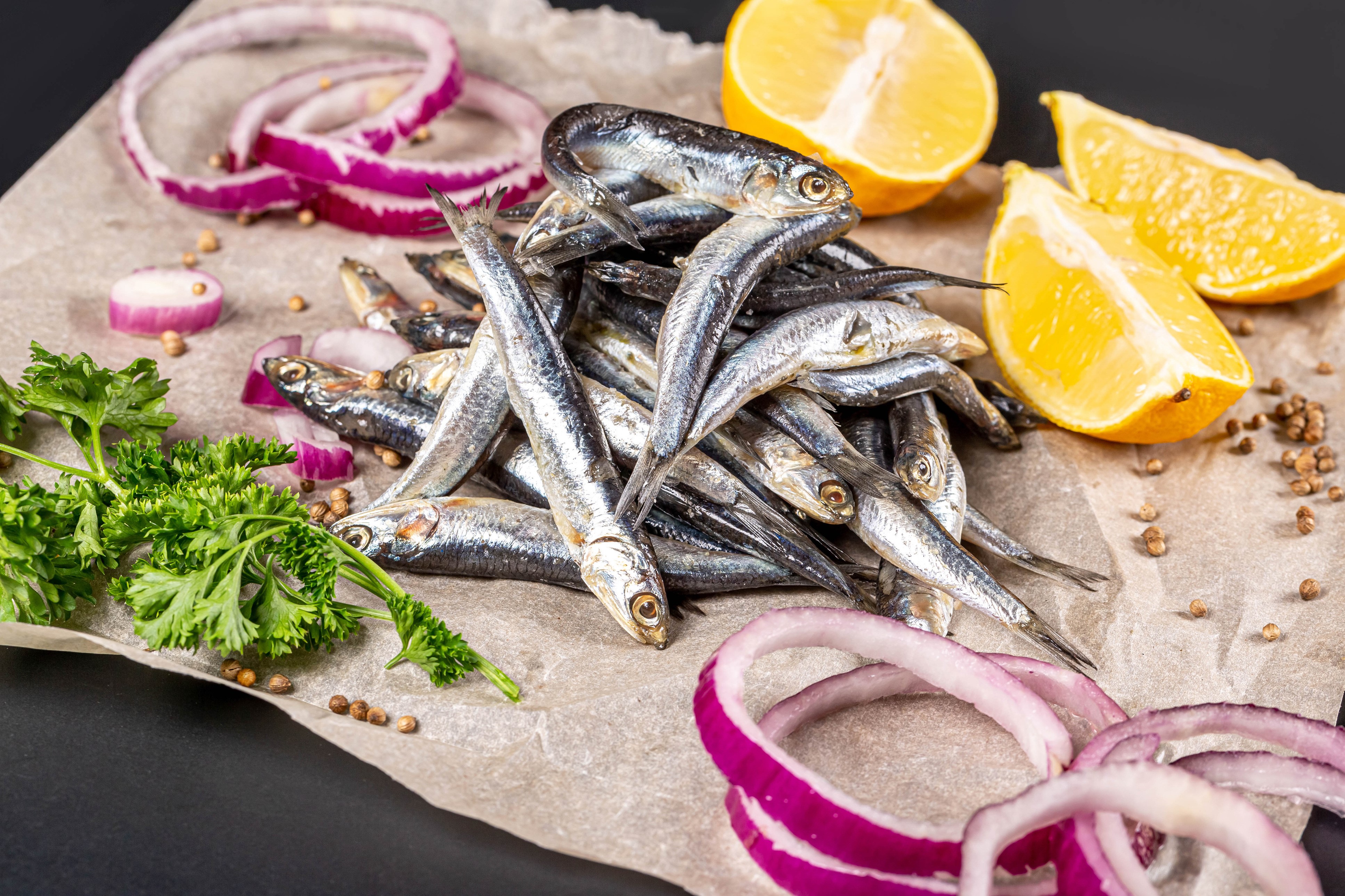 Pile of Anchovies with Lemon, Onion, and Parsley HD Wallpaper