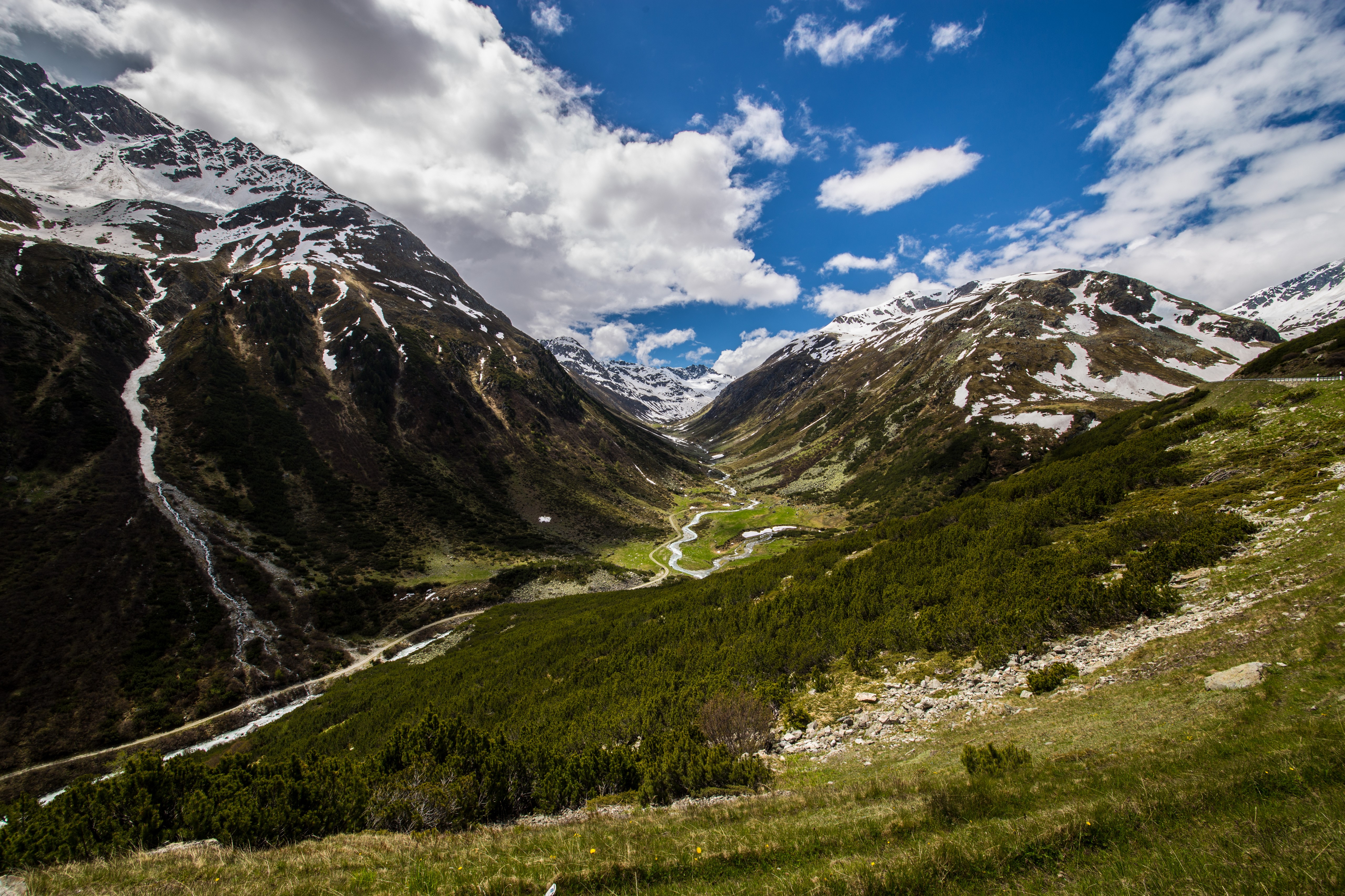 Valley in the Swiss Alps with Snow-Capped Mountains HD Wallpaper