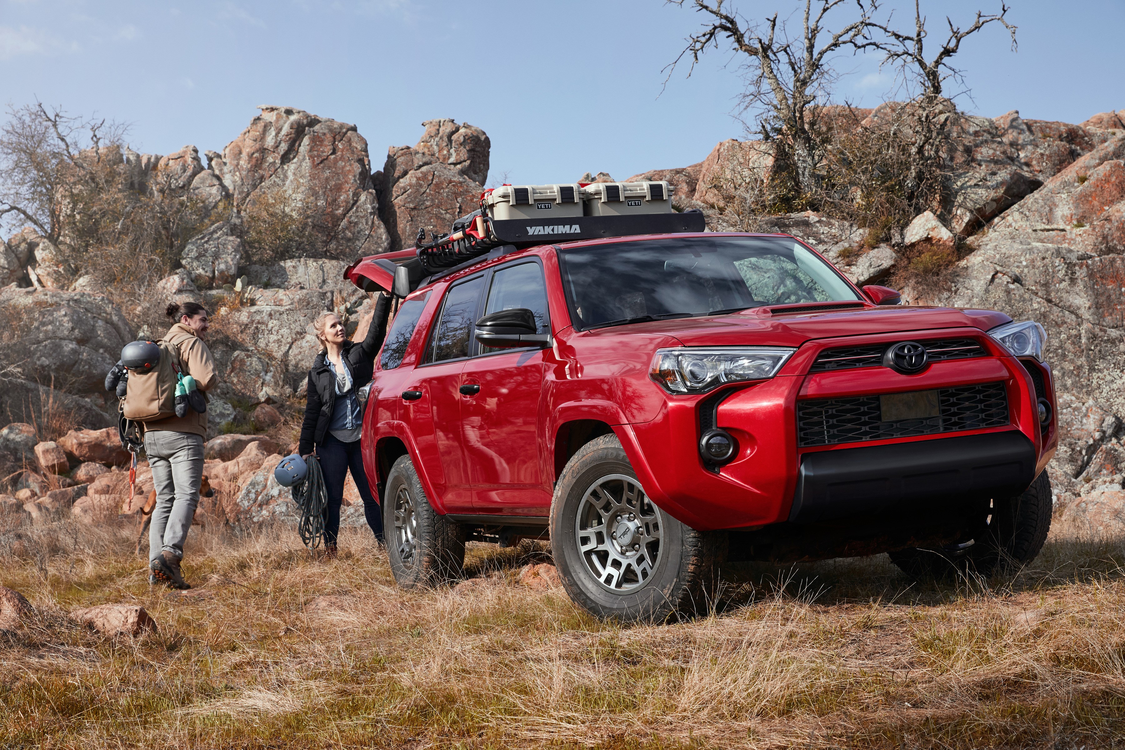 Red Toyota 4Runner Venture Edition SUV with people and gear HD Wallpaper