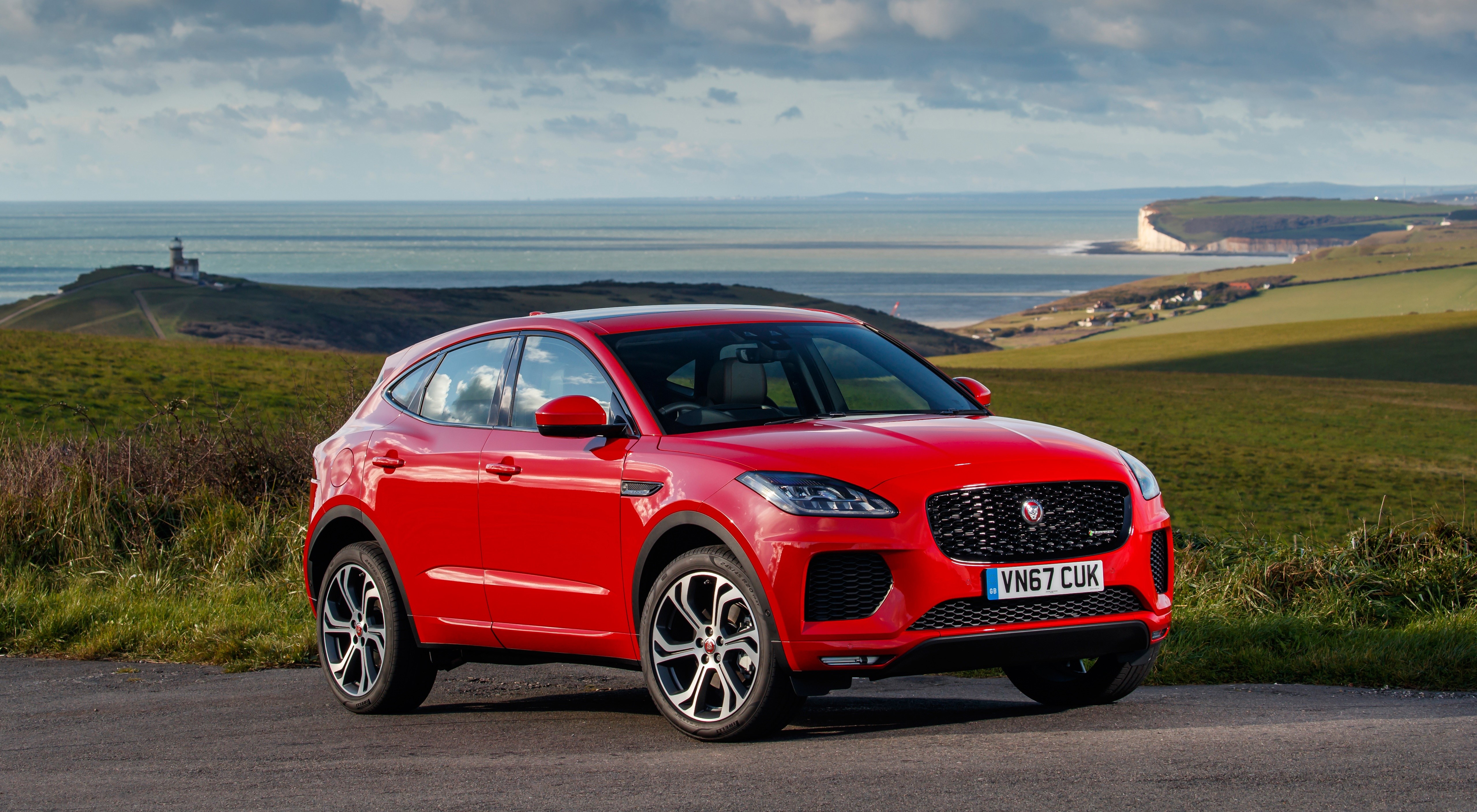 Red Jaguar E-Pace R-Dynamic First Edition parked by the sea HD Wallpaper