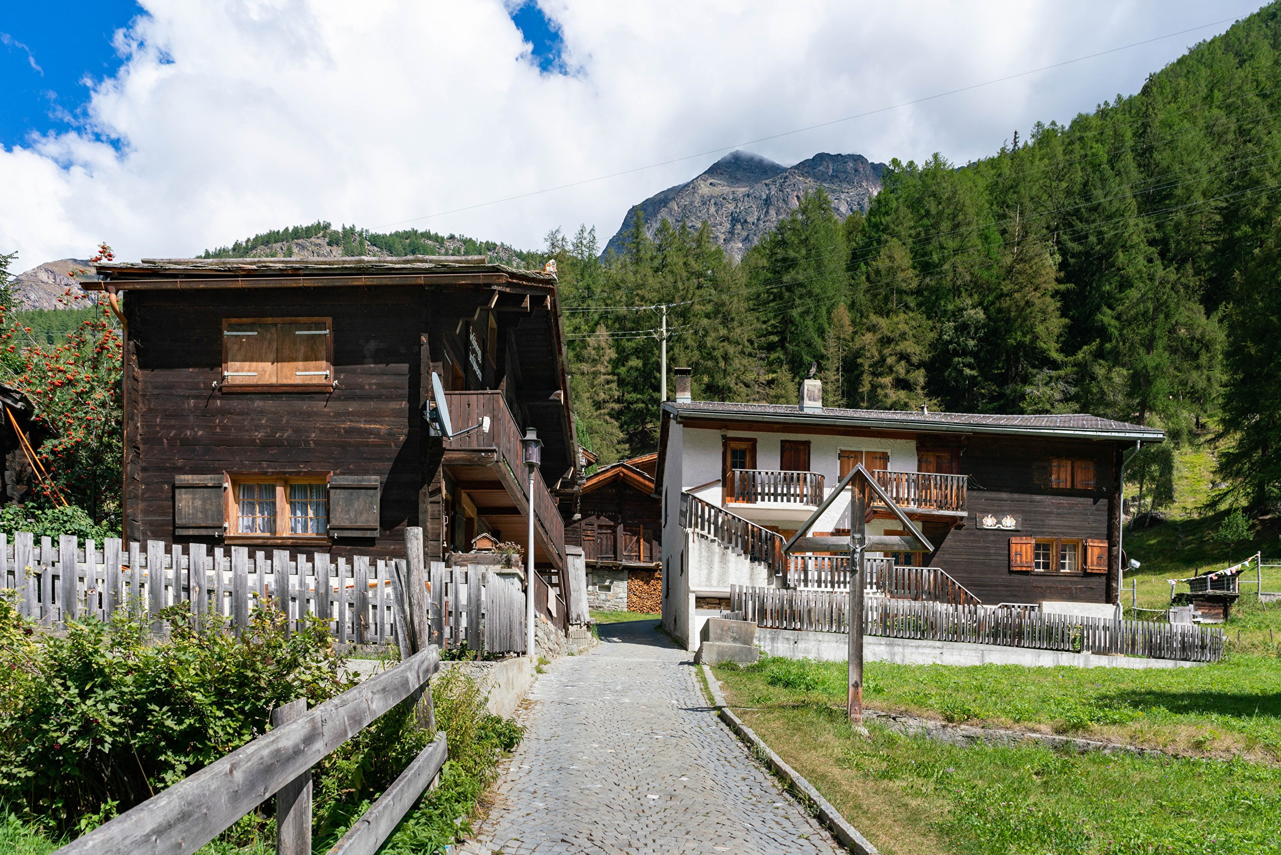 Village of Randa, Switzerland with traditional wooden houses HD Wallpaper
