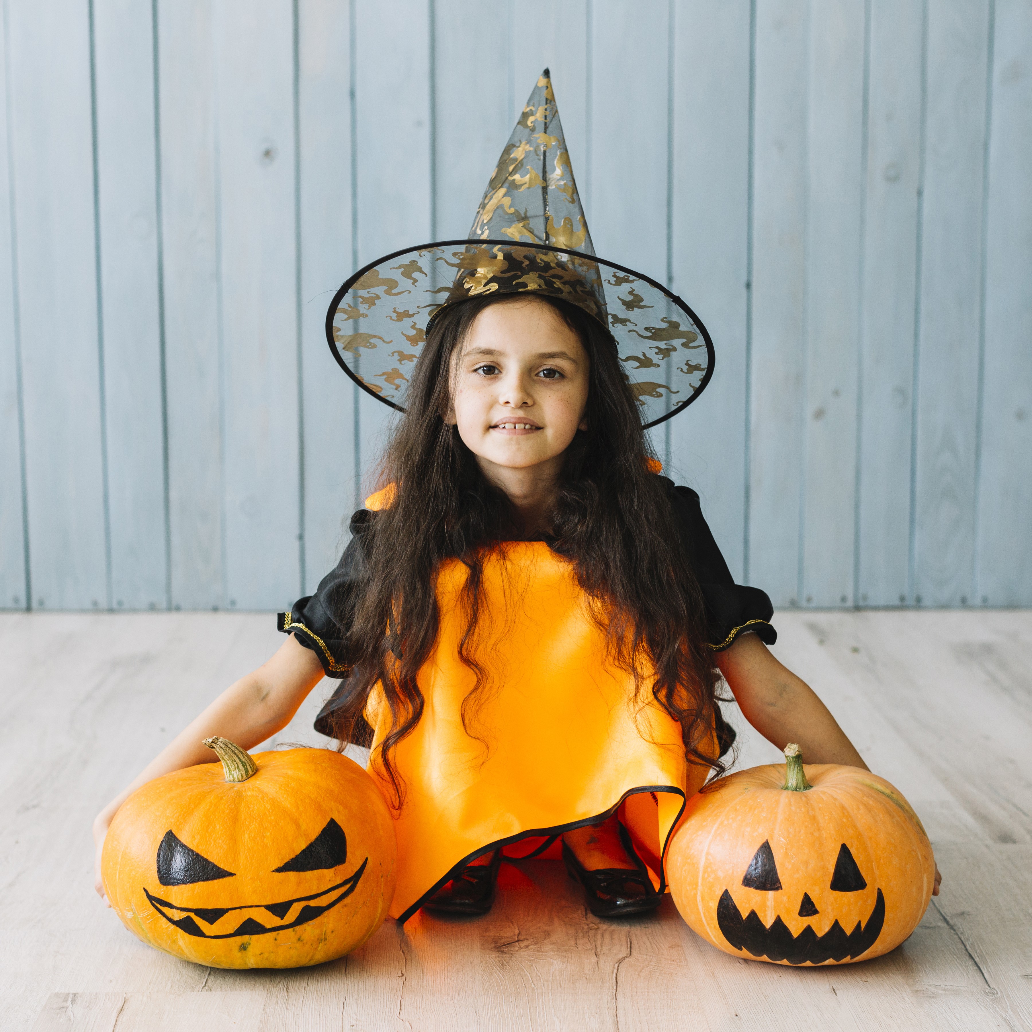 Girl in witch costume with pumpkins HD Wallpaper