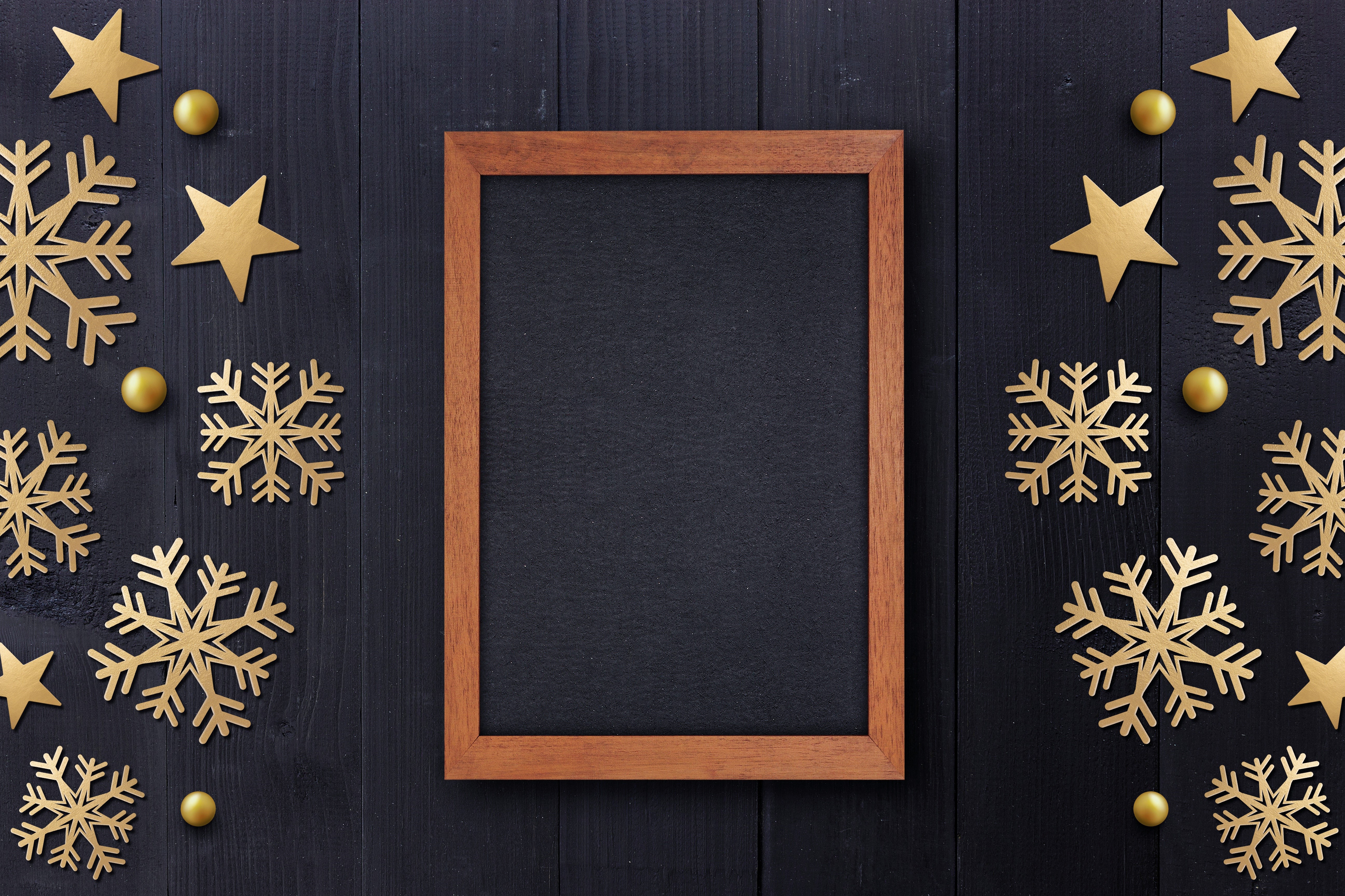 Christmas snowflakes and stars on a dark wooden background with a frame HD Wallpaper