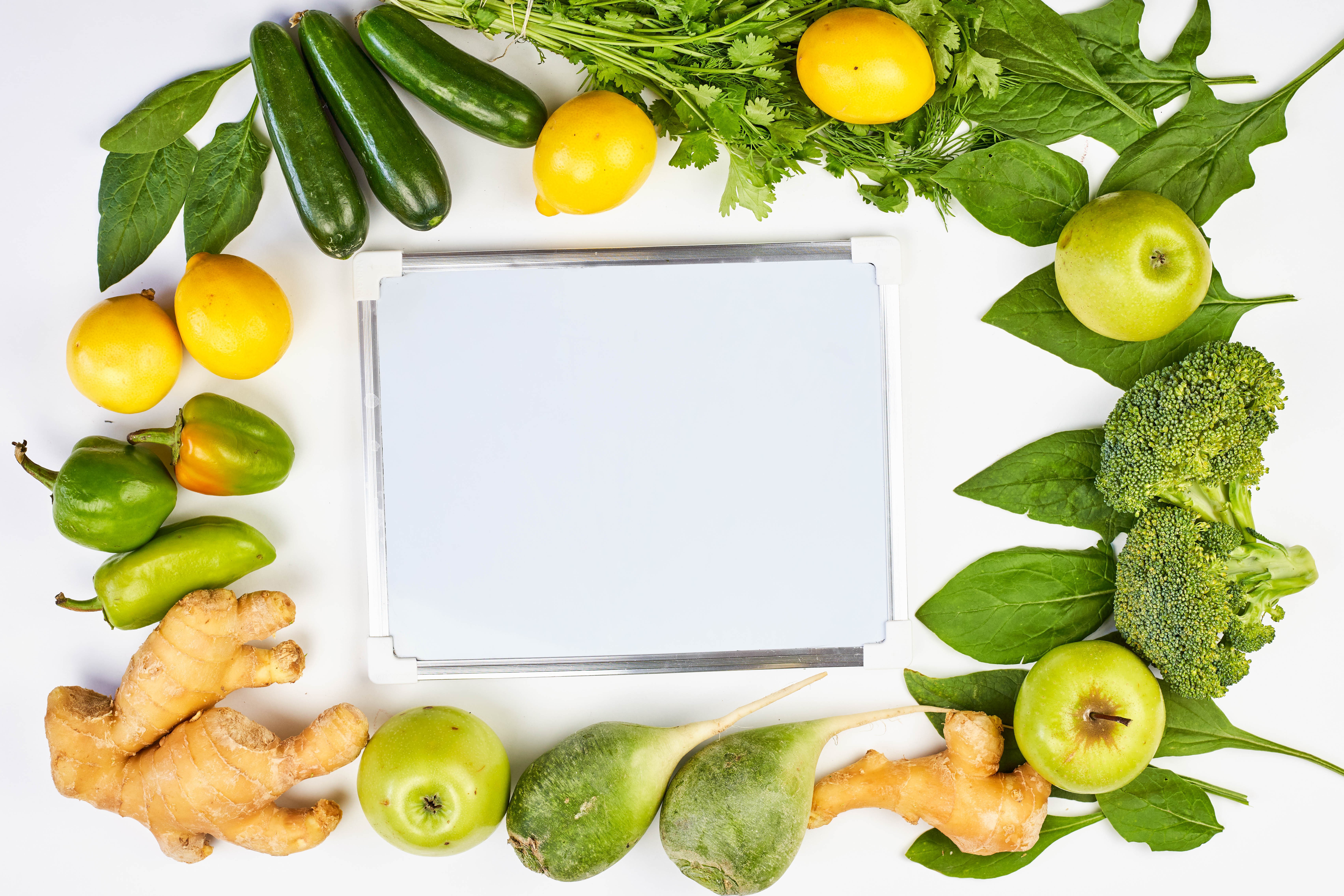 Vegetables and fruits arranged around a whiteboard HD Wallpaper