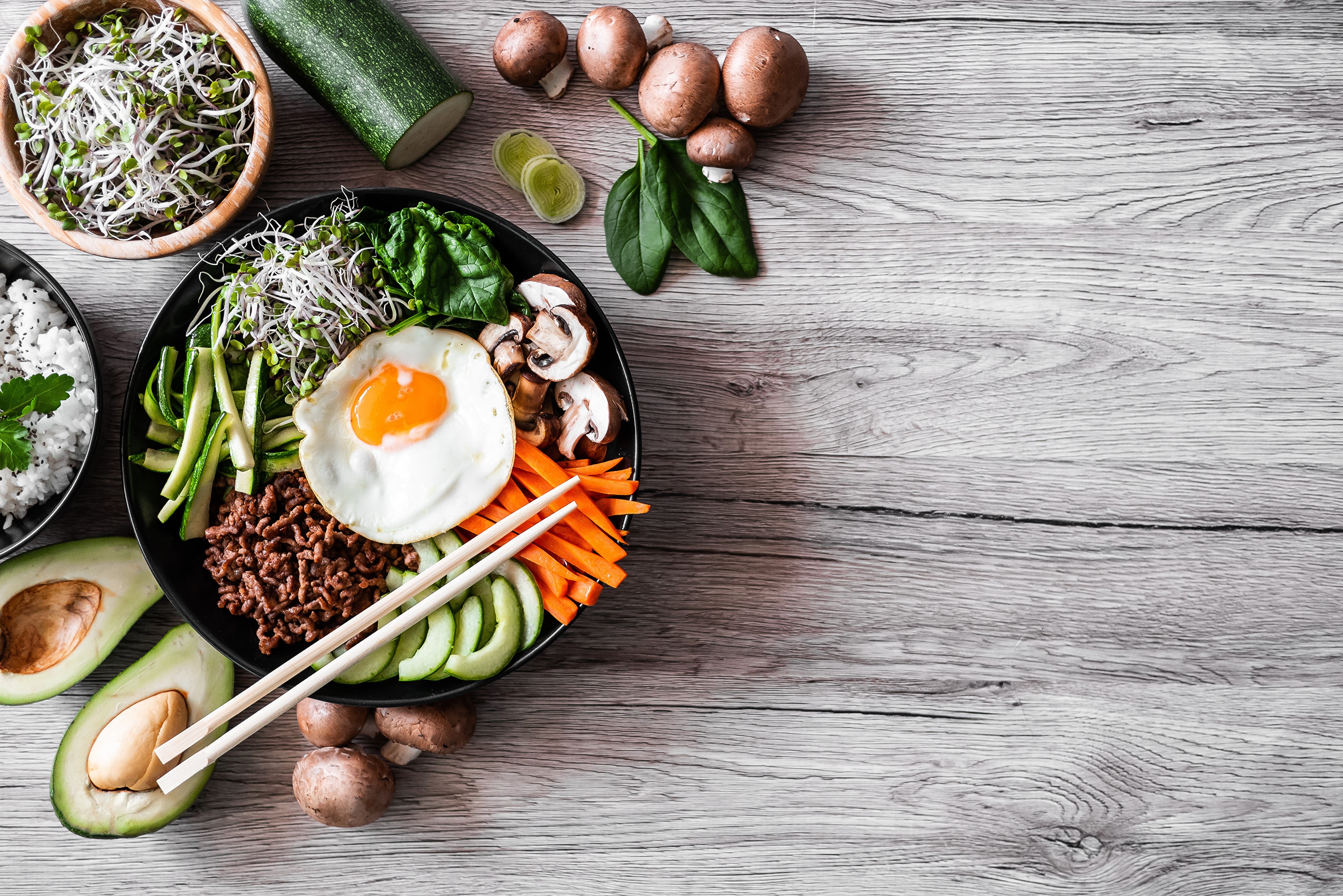 Bibimbap with Fried Egg, Mushrooms, Avocado, and Sprouts HD Wallpaper