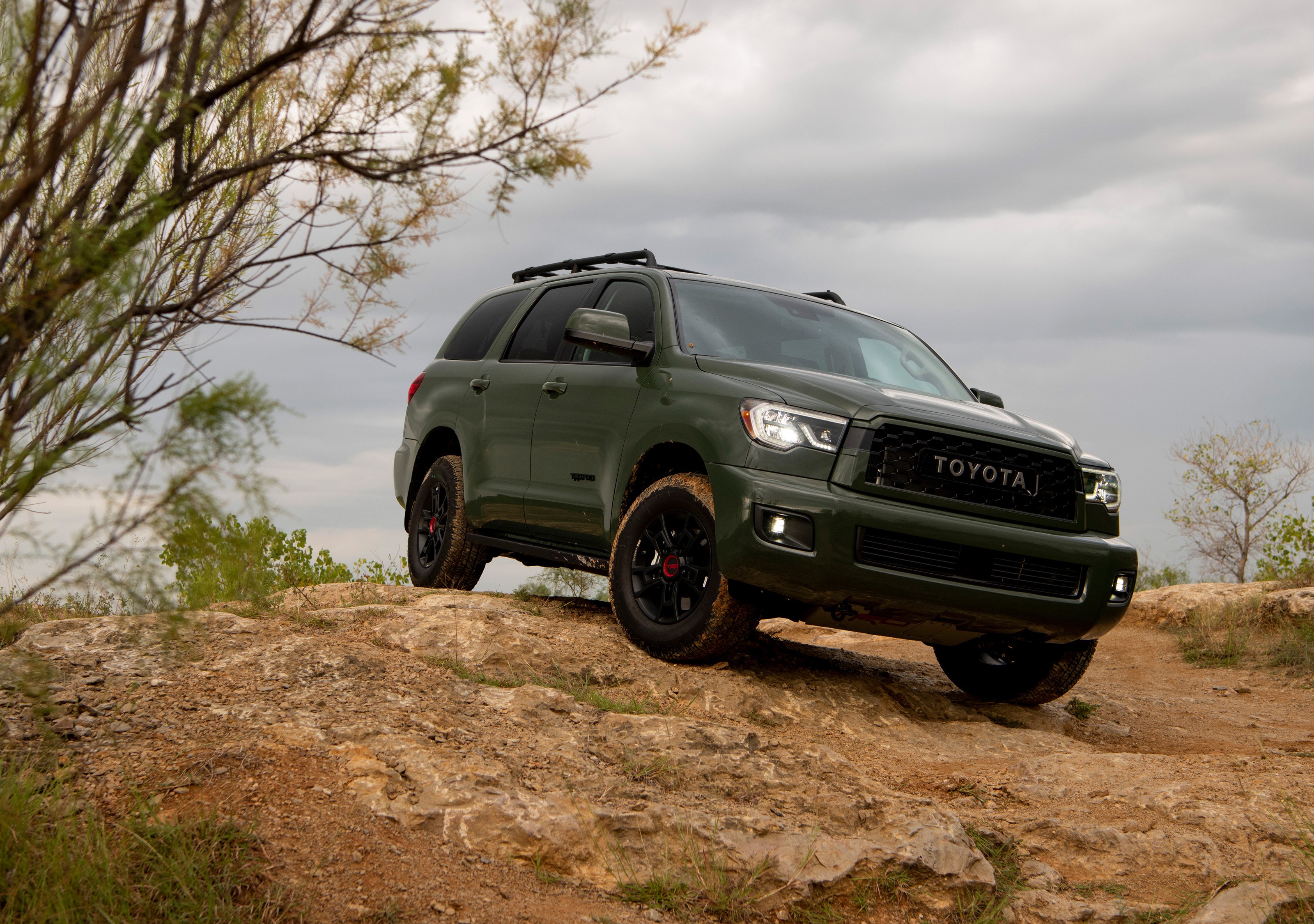 Green Toyota Sequoia TRD Pro on rocky terrain HD Wallpaper