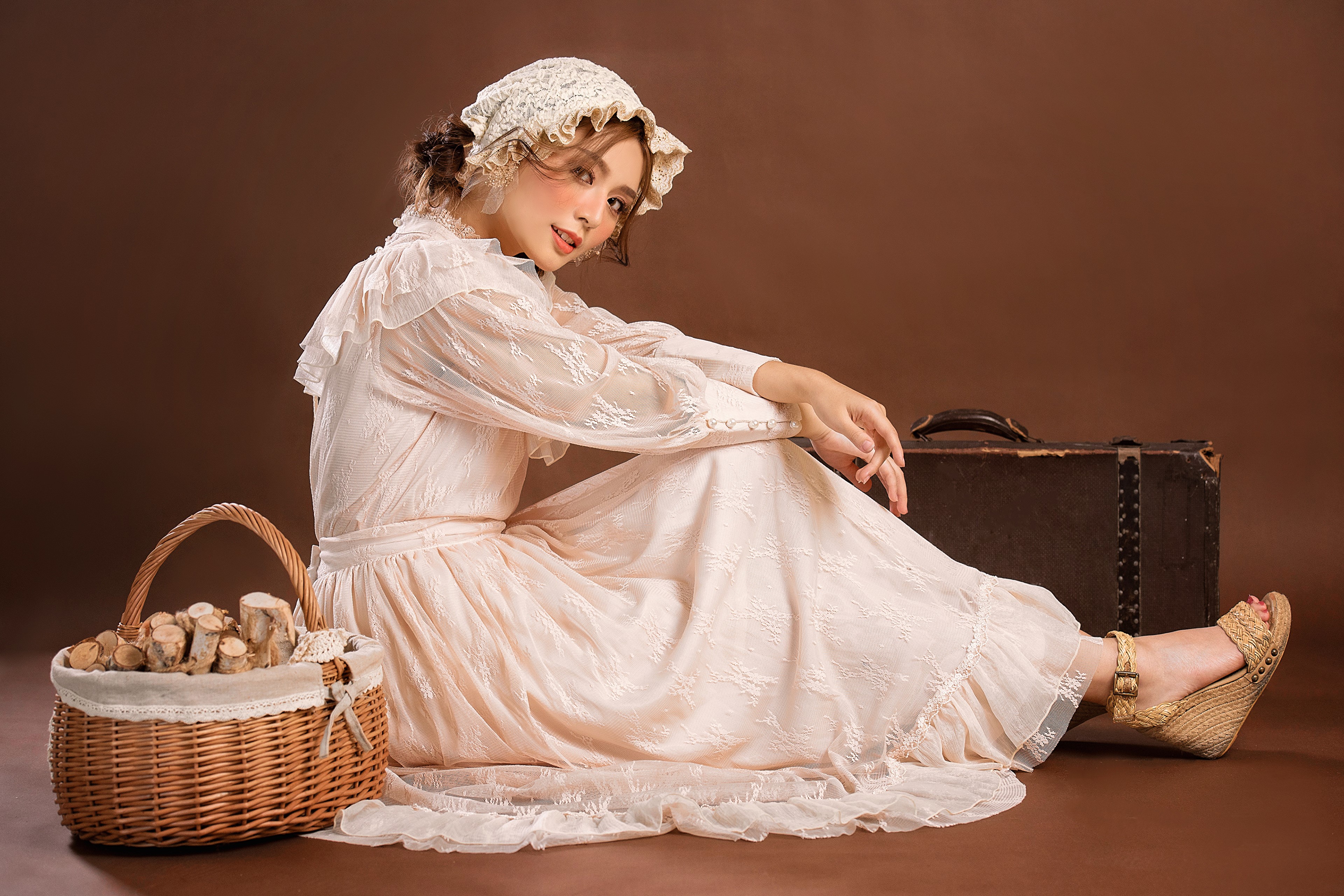 Asian woman in retro dress with suitcase and basket HD Wallpaper