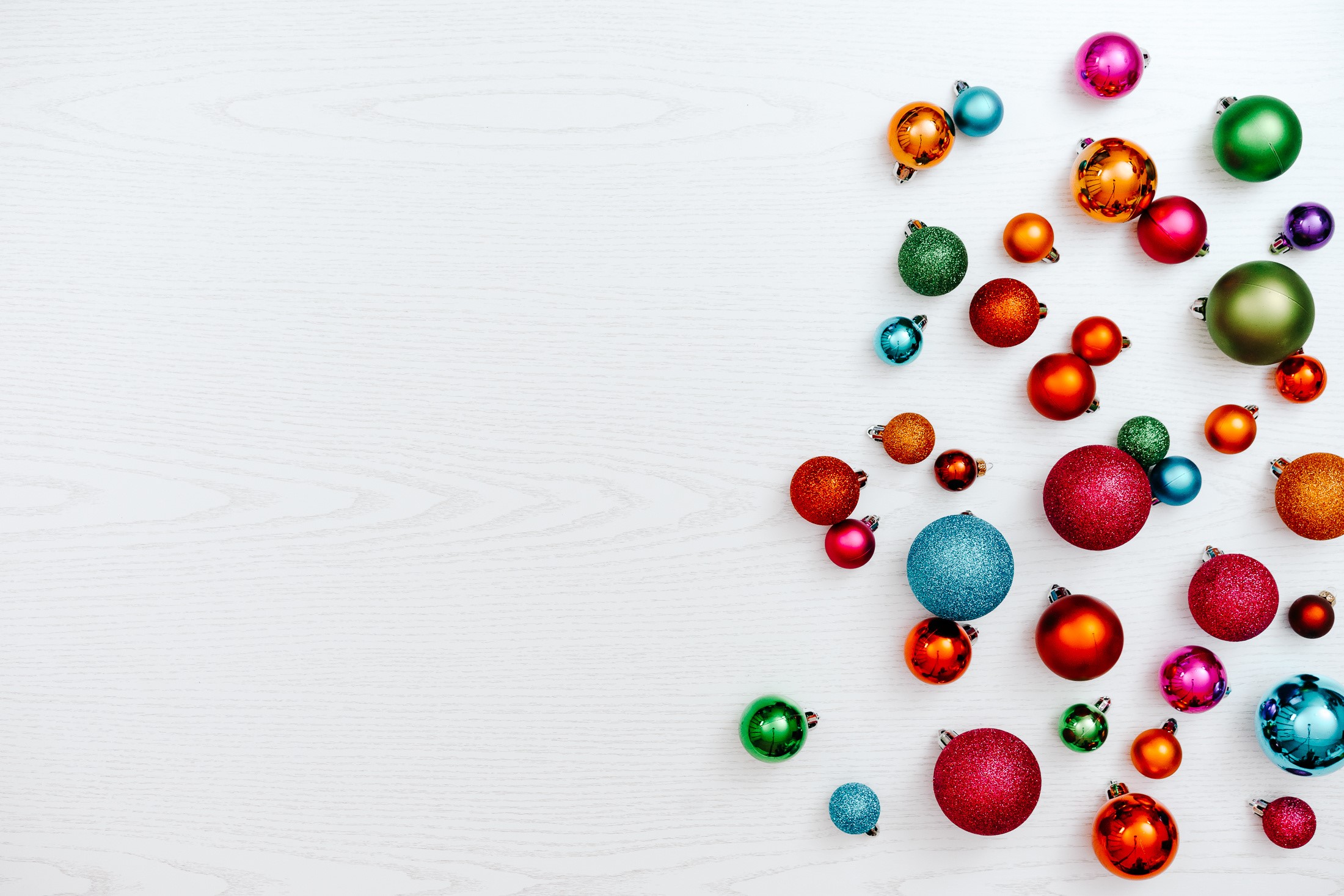 Scattered Christmas Ornaments on White Background HD Wallpaper
