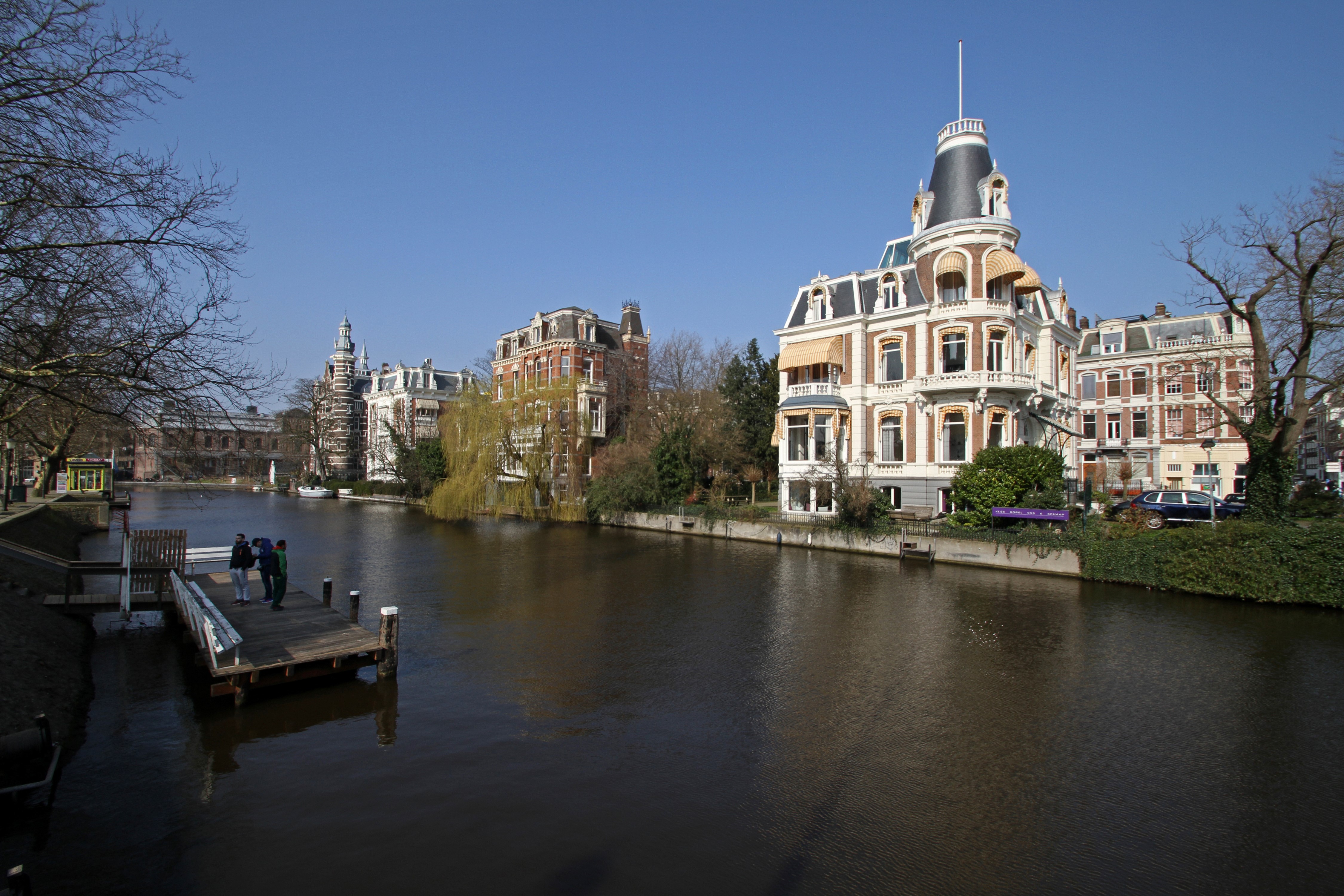 Houses on a canal in Amsterdam, Netherlands HD Wallpaper