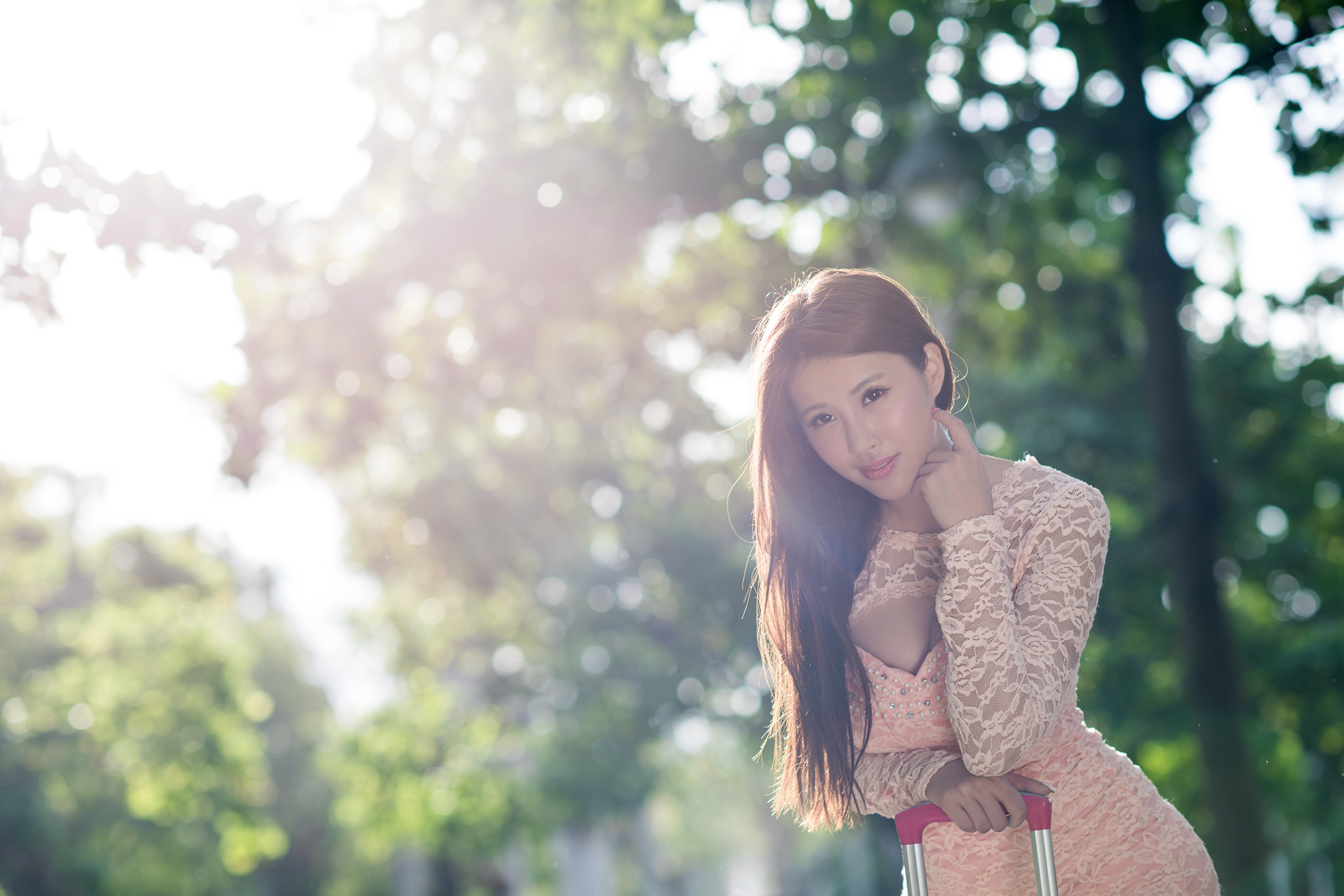 Asian woman in a pink dress with a suitcase HD Wallpaper