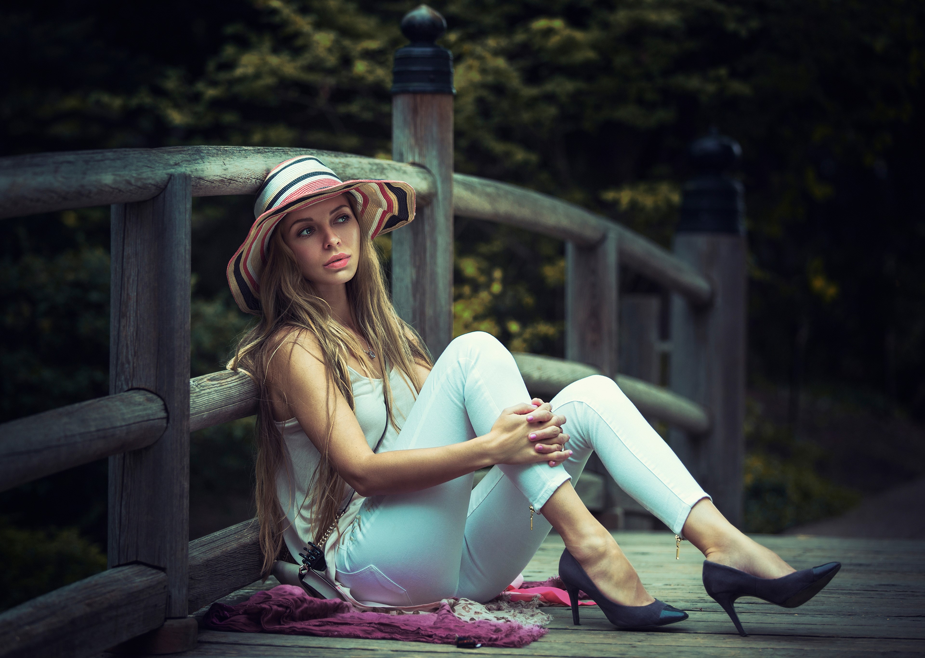 Woman in Hat Sitting on Wooden Bridge HD Wallpaper