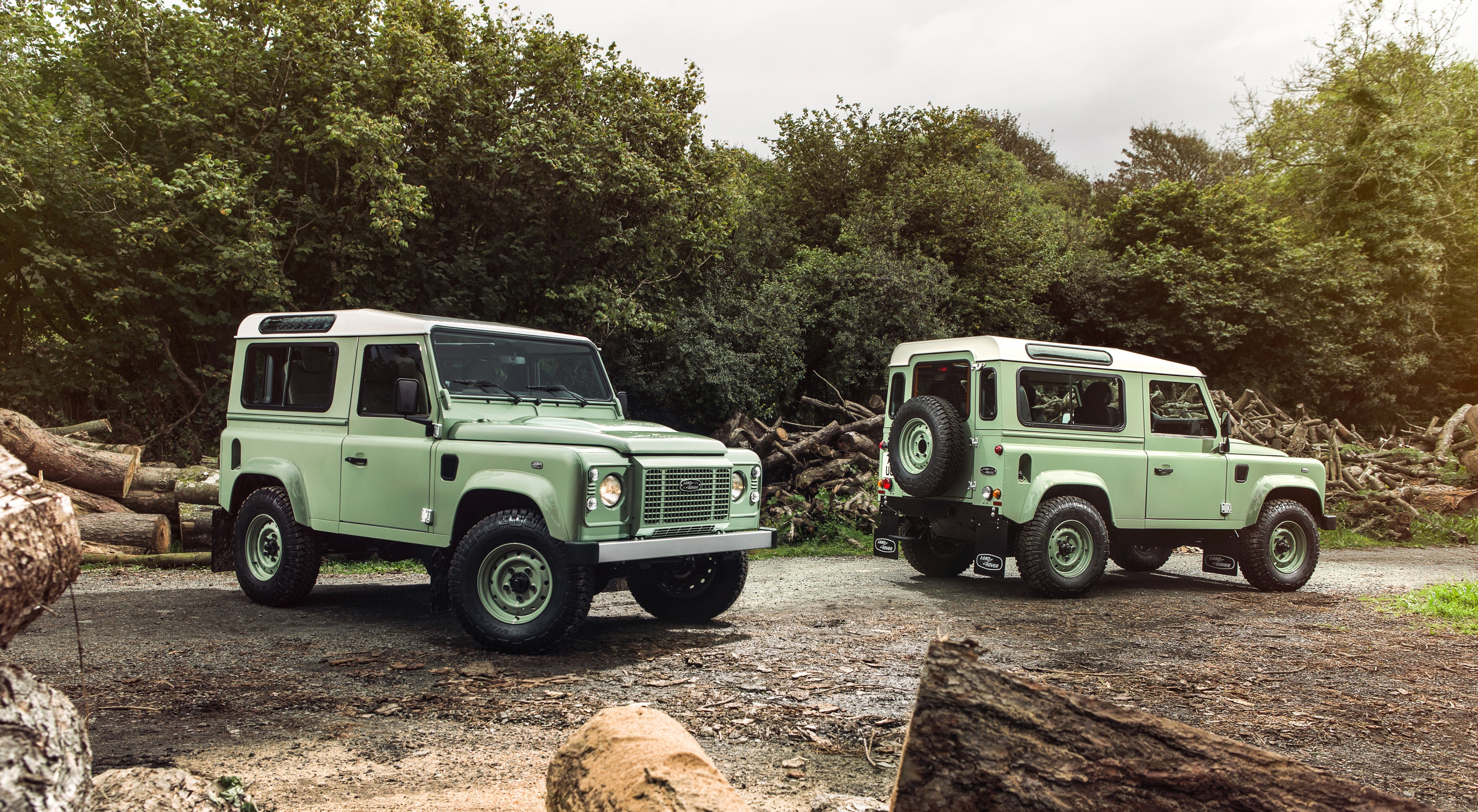 Two Land Rover Defender 90 Heritage SUVs HD Wallpaper