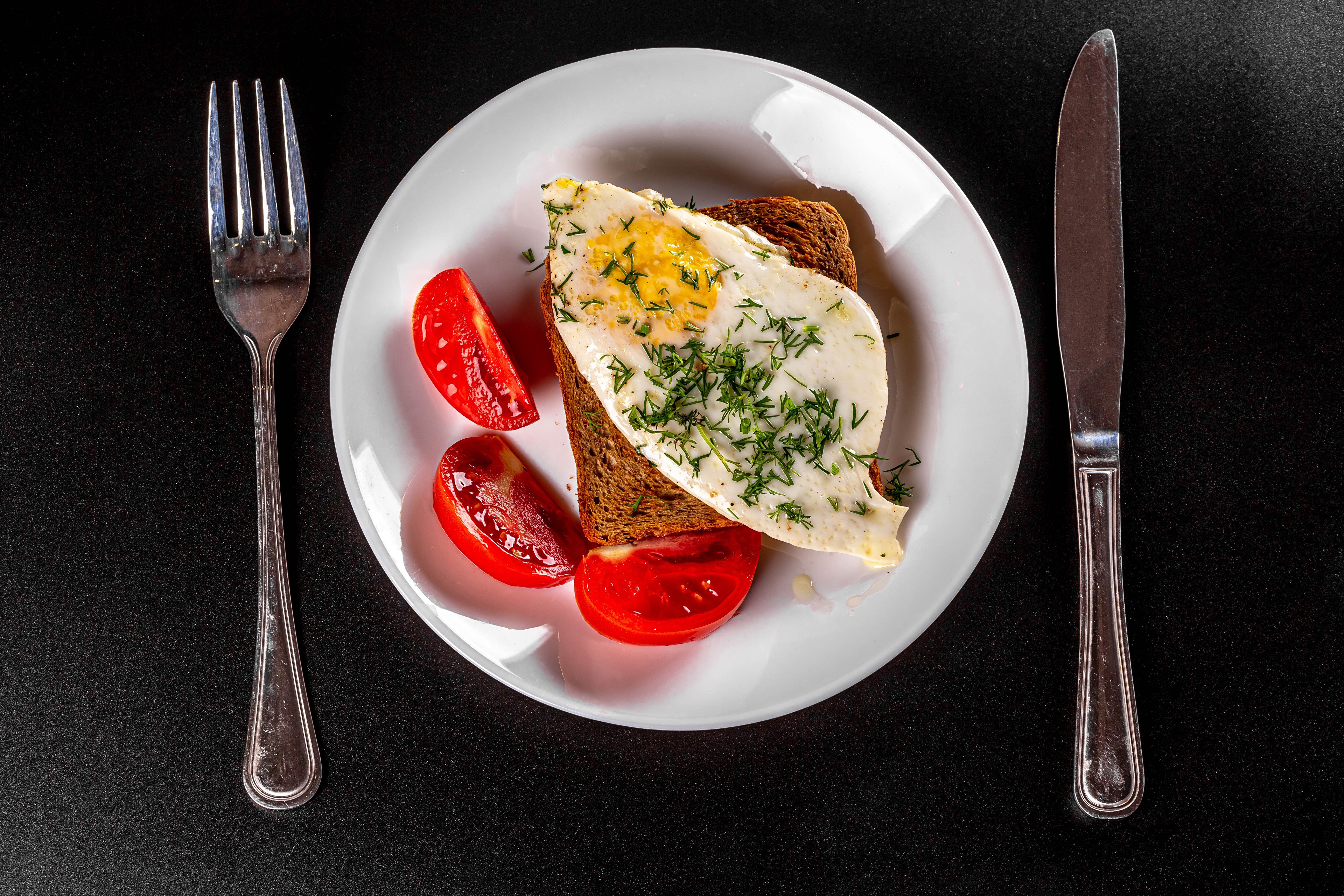 Fried egg on toast with tomatoes, fork, and knife HD Wallpaper