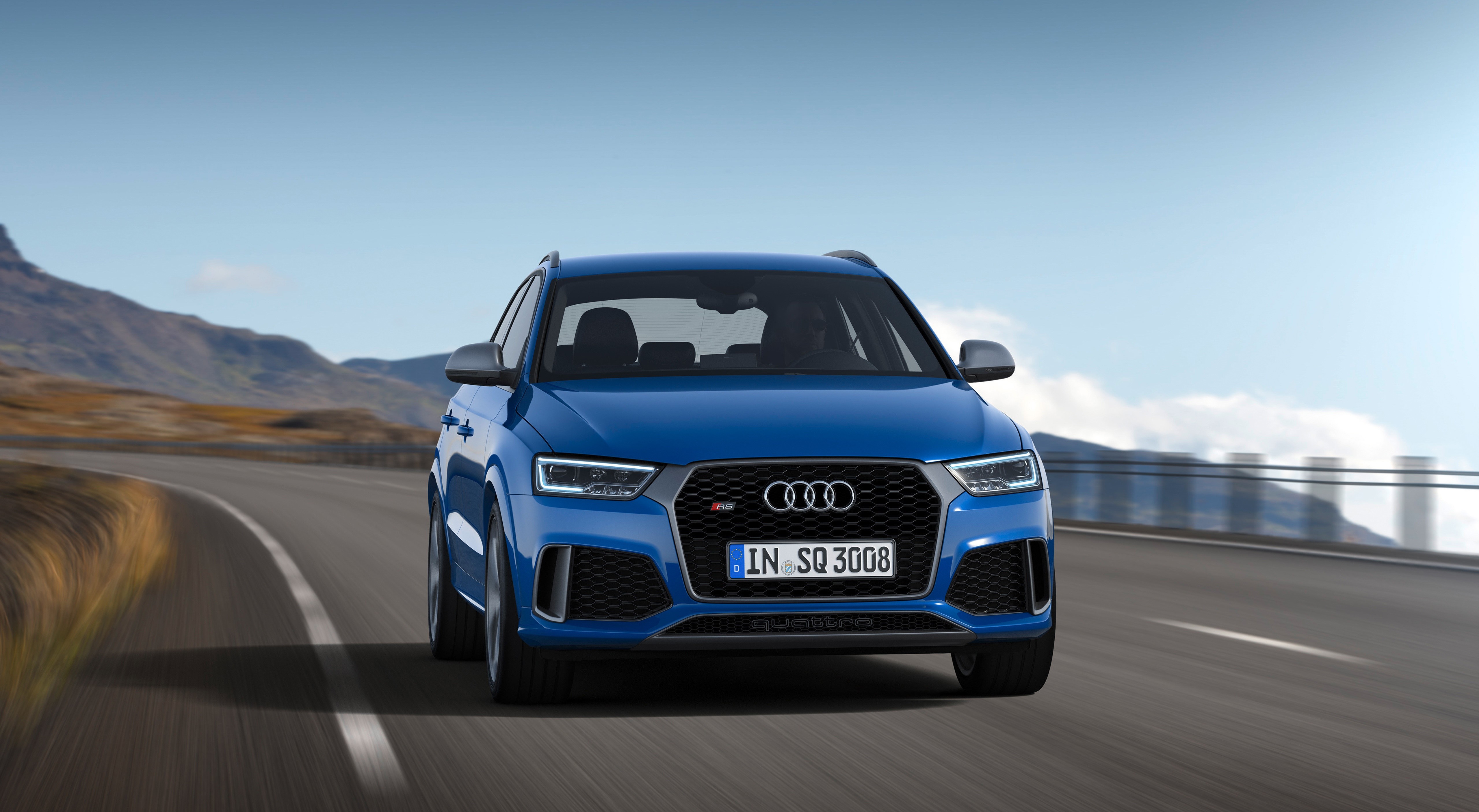 Blue Audi RS Q3 Quattro driving on a mountain road HD Wallpaper