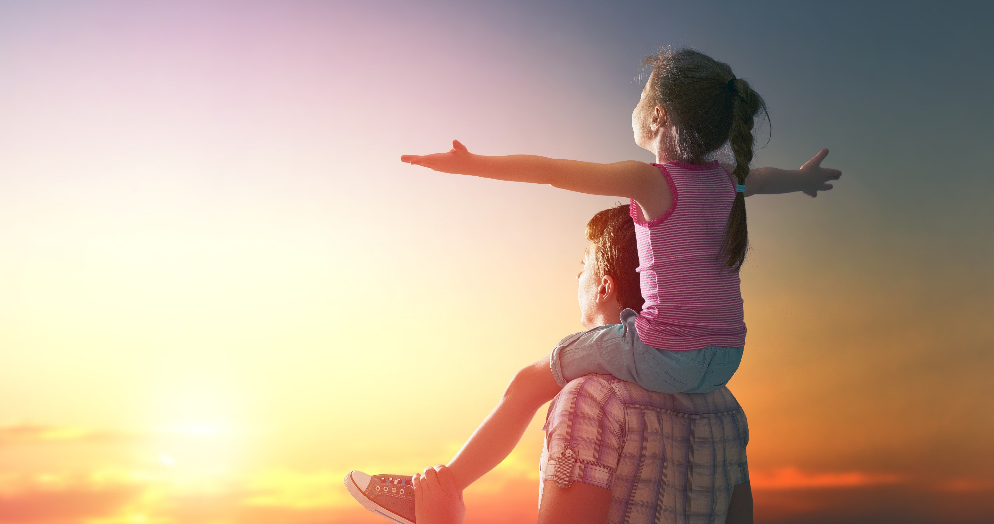 Father and Daughter Enjoying a Sunset HD Wallpaper