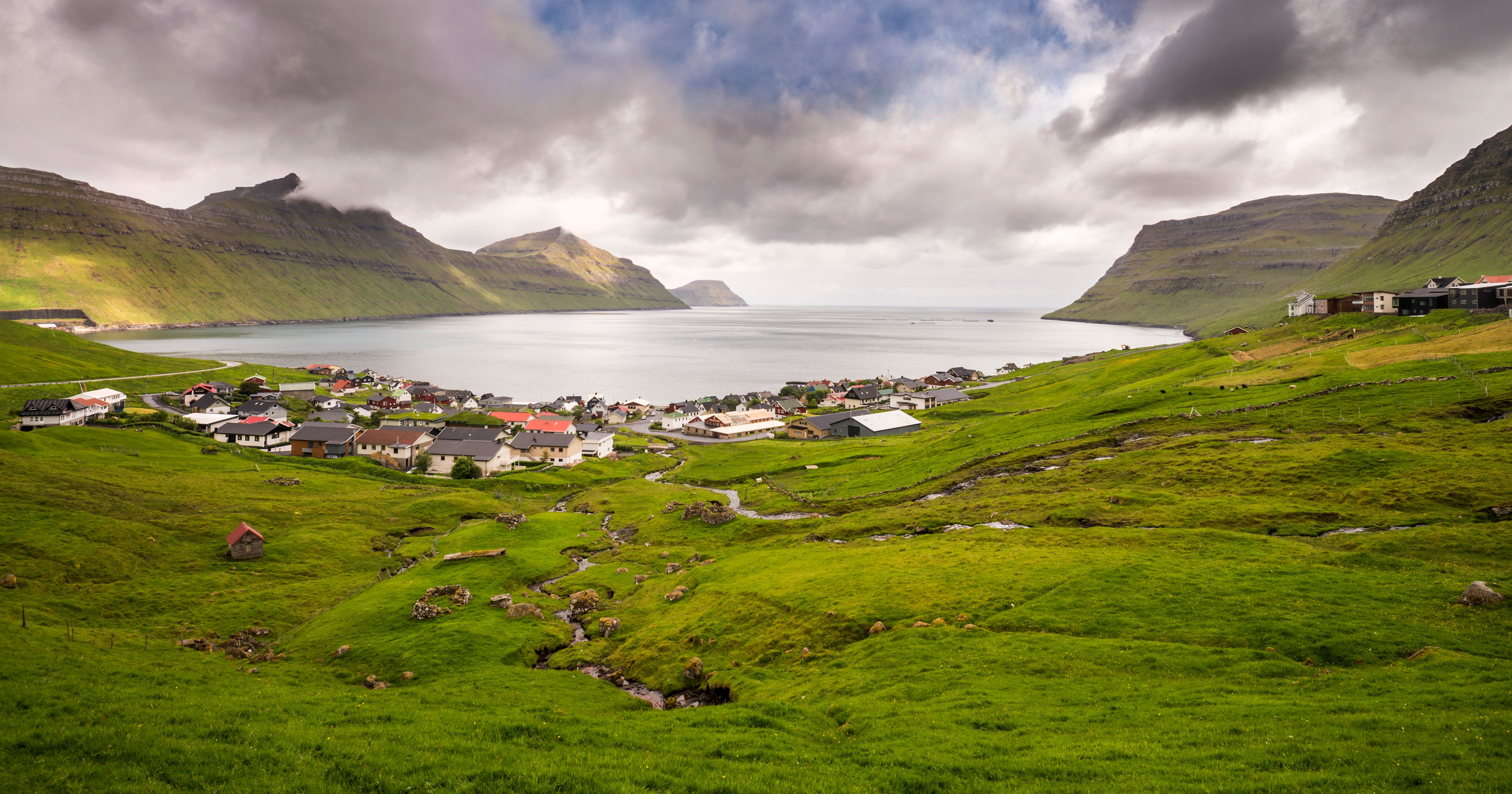 Faroe Islands village with mountains and bay HD Wallpaper