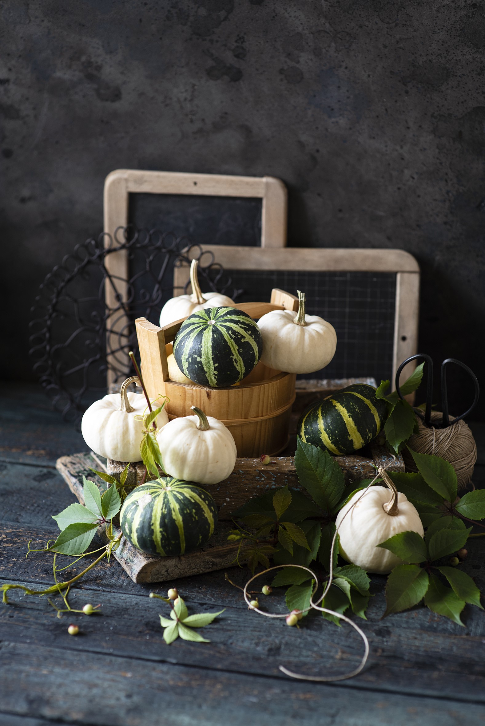 Pumpkins in a wooden bucket with chalkboards HD Phone Wallpaper