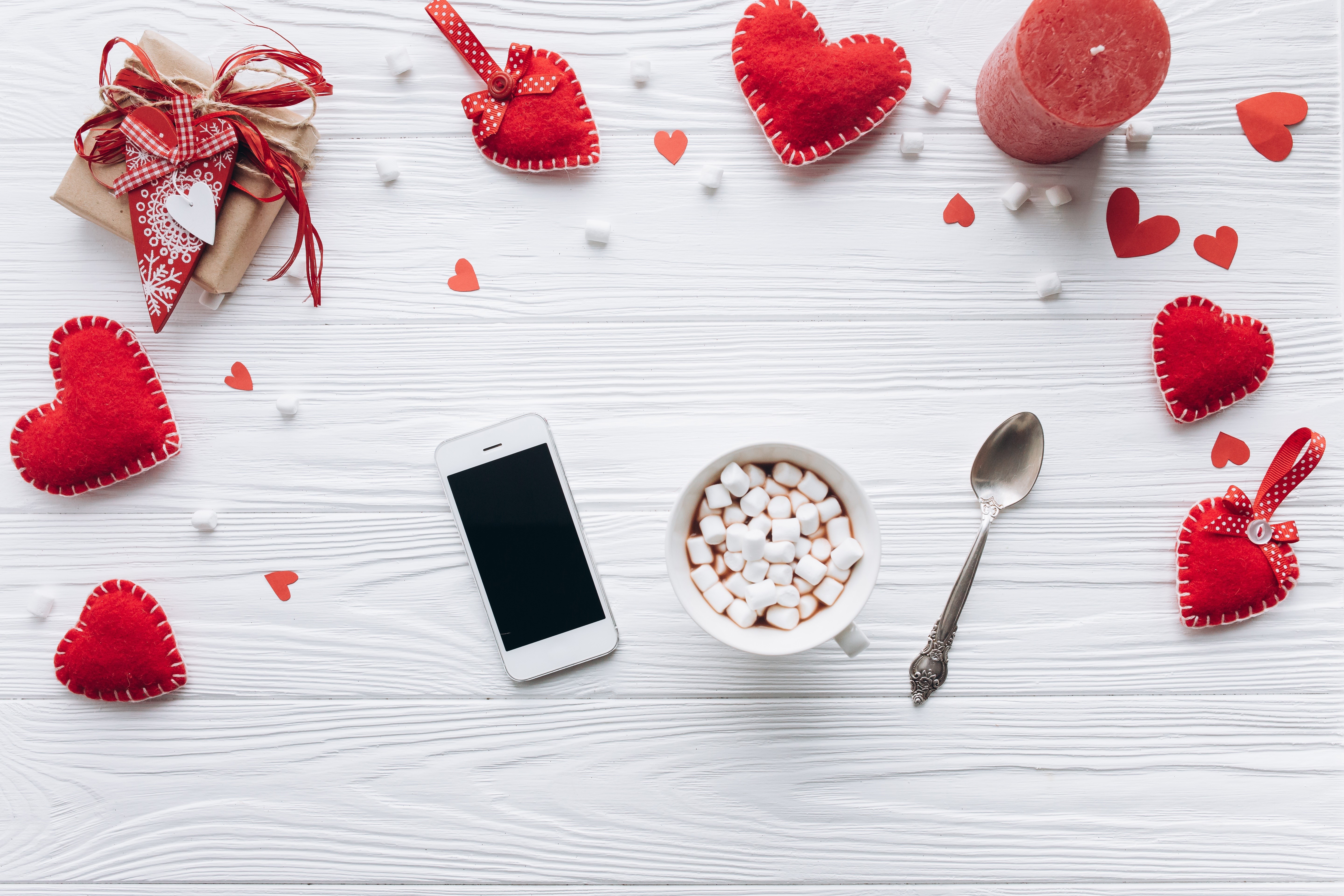 Valentine's Day flat lay with gift, hot chocolate, and smartphone HD Wallpaper