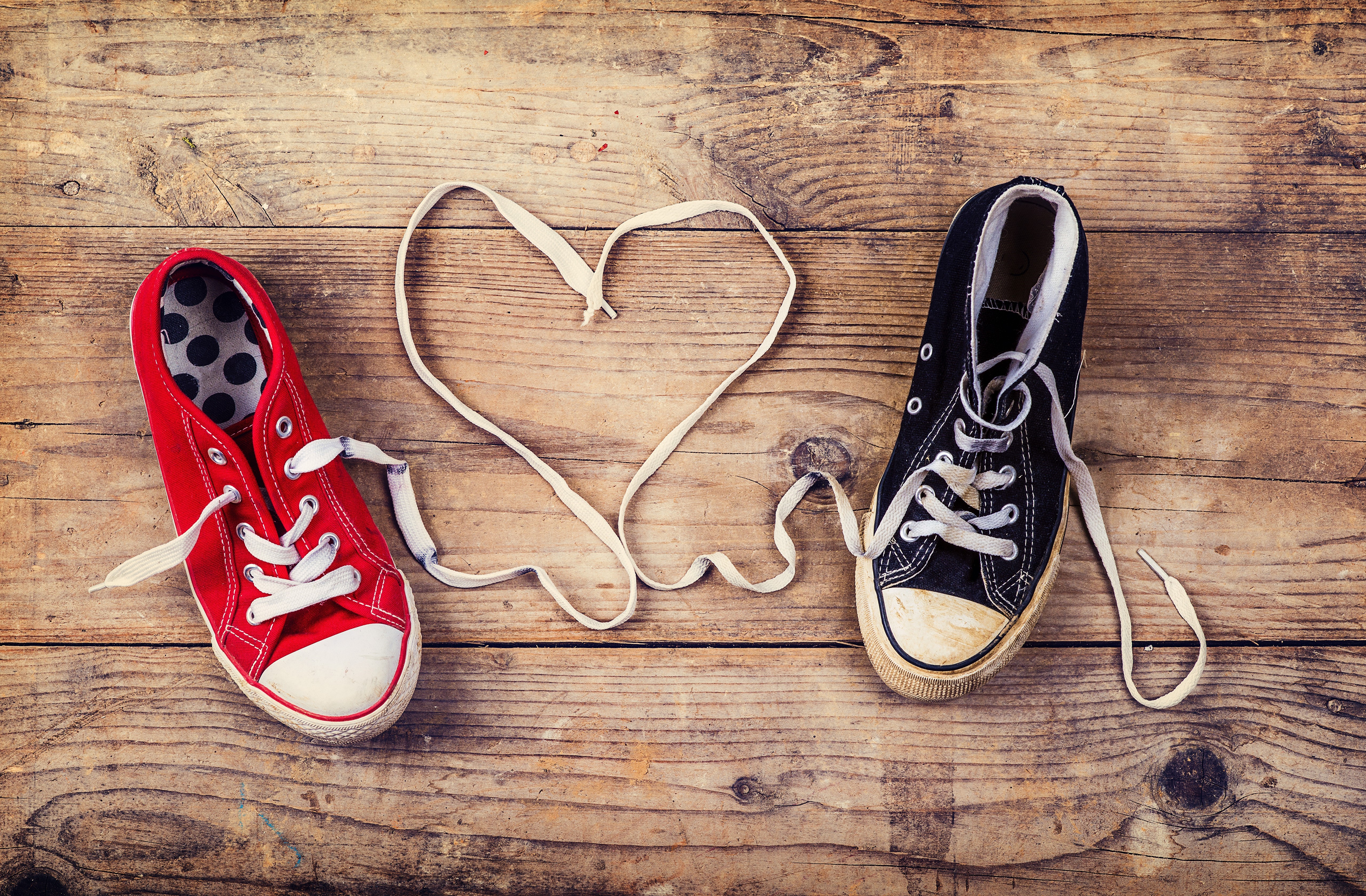 Red and black plimsoll shoes forming a heart HD Wallpaper