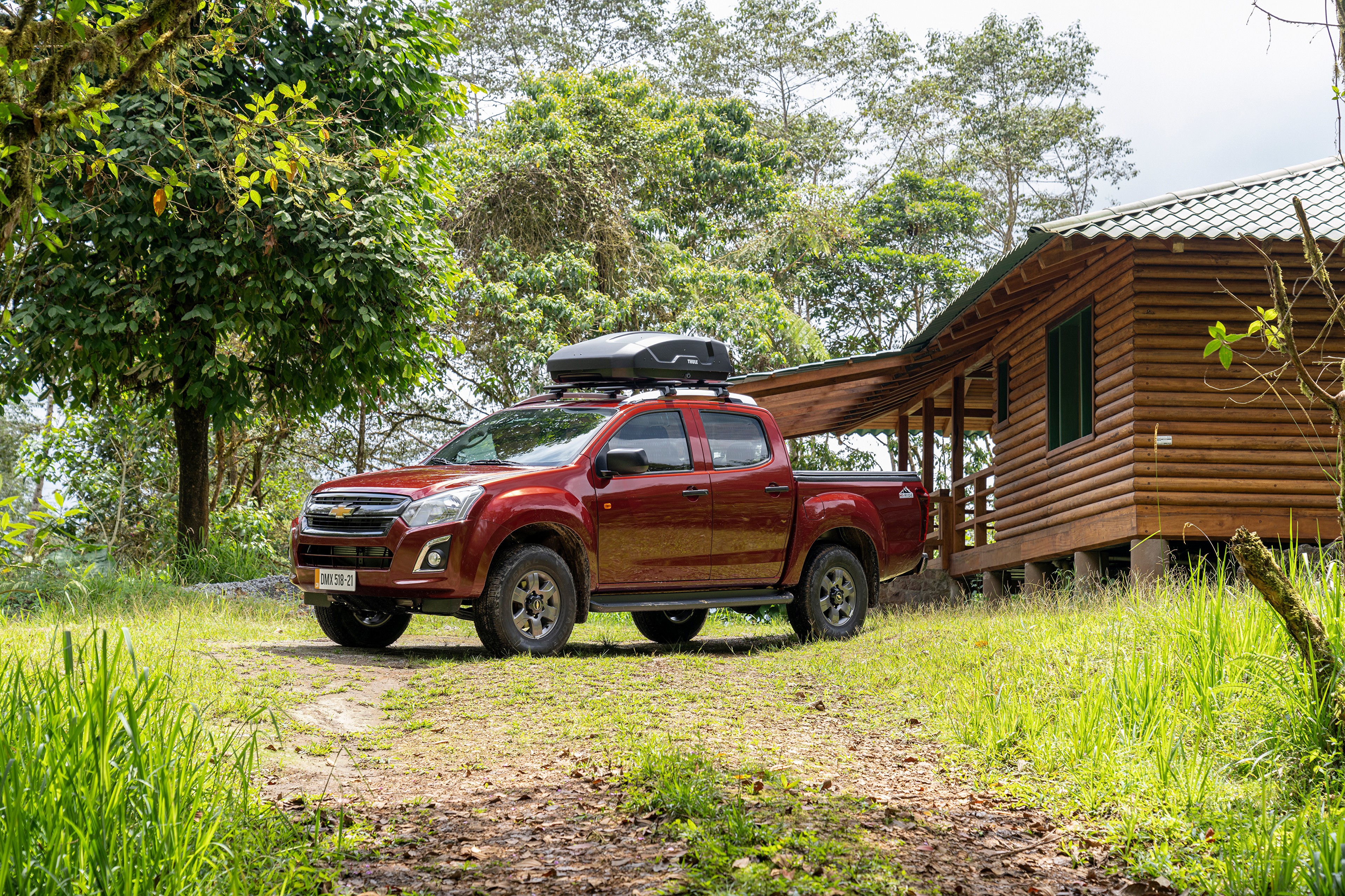 Red Chevrolet D-Max Pickup with Roof Box near Cabin HD Wallpaper