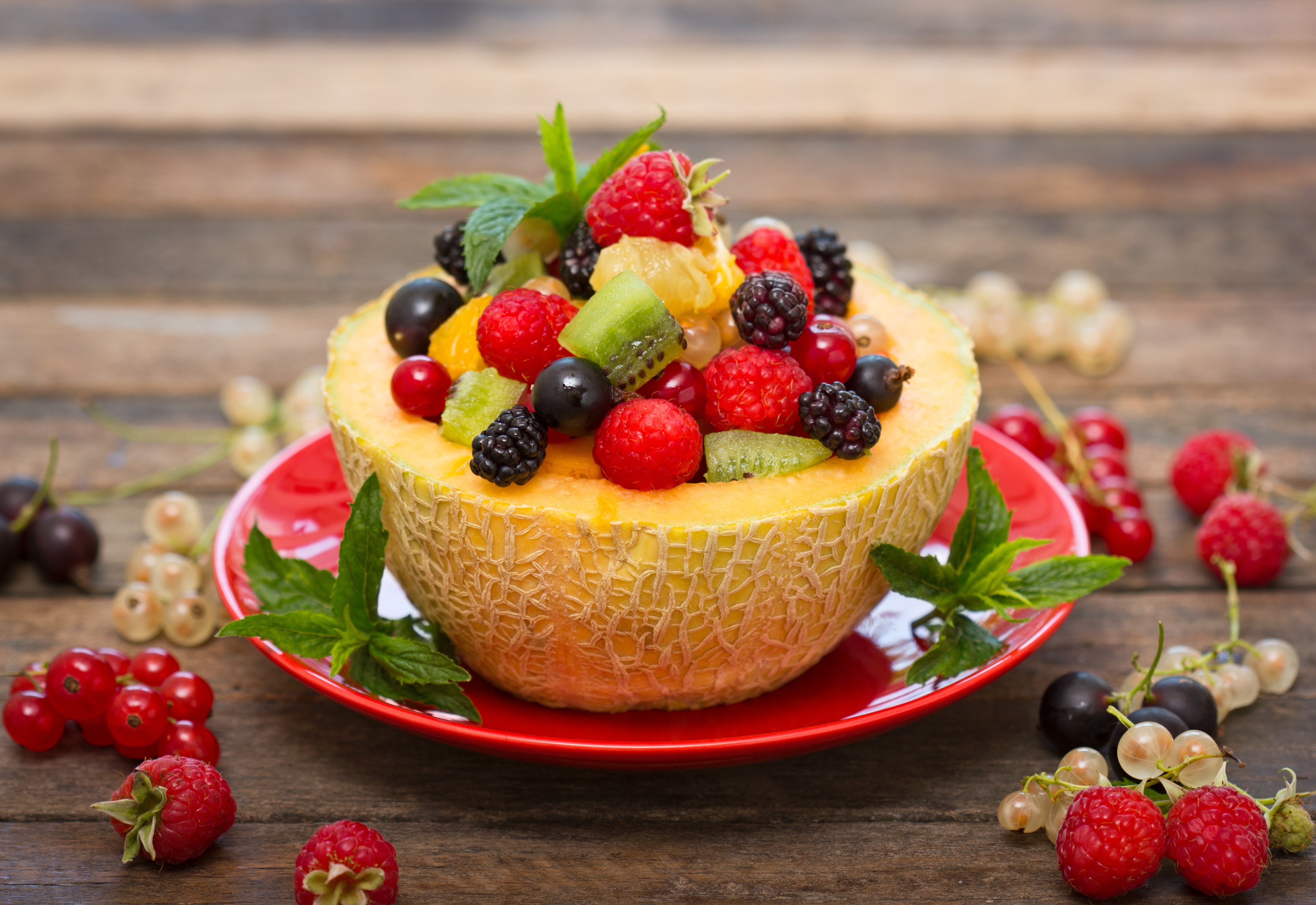 Fruit salad in a melon bowl with berries HD Wallpaper