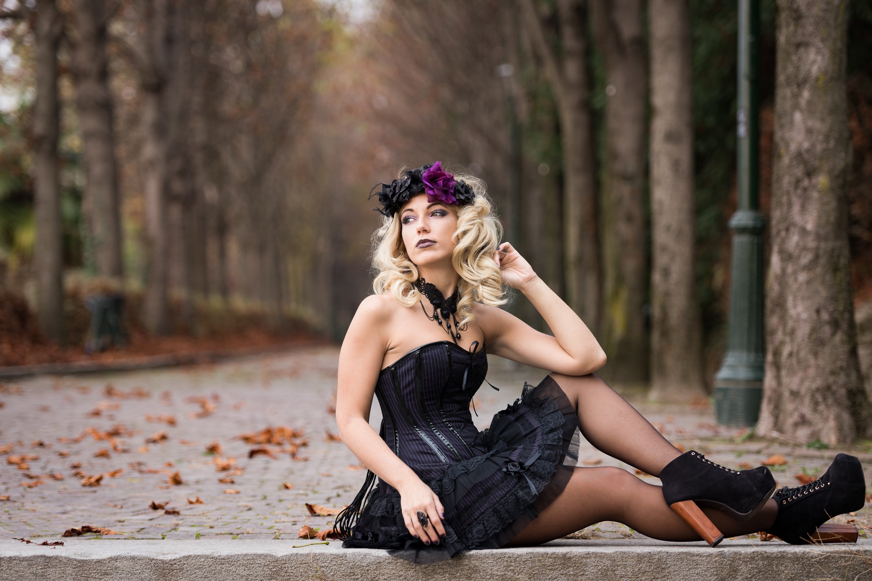 Woman with flower wreath sitting in autumn park HD Wallpaper
