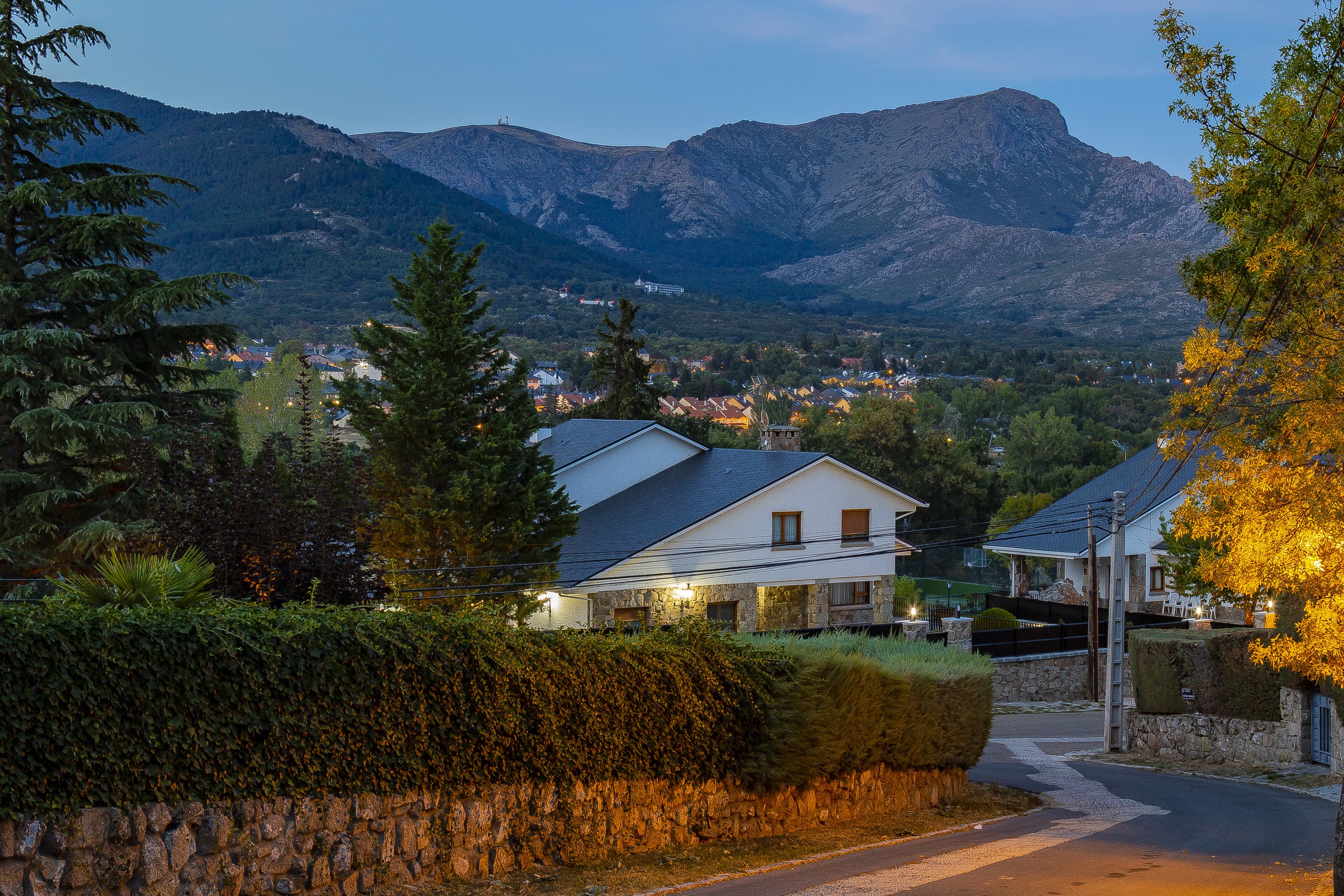 Houses in Navacerrada, Spain at Evening with Mountains HD Wallpaper