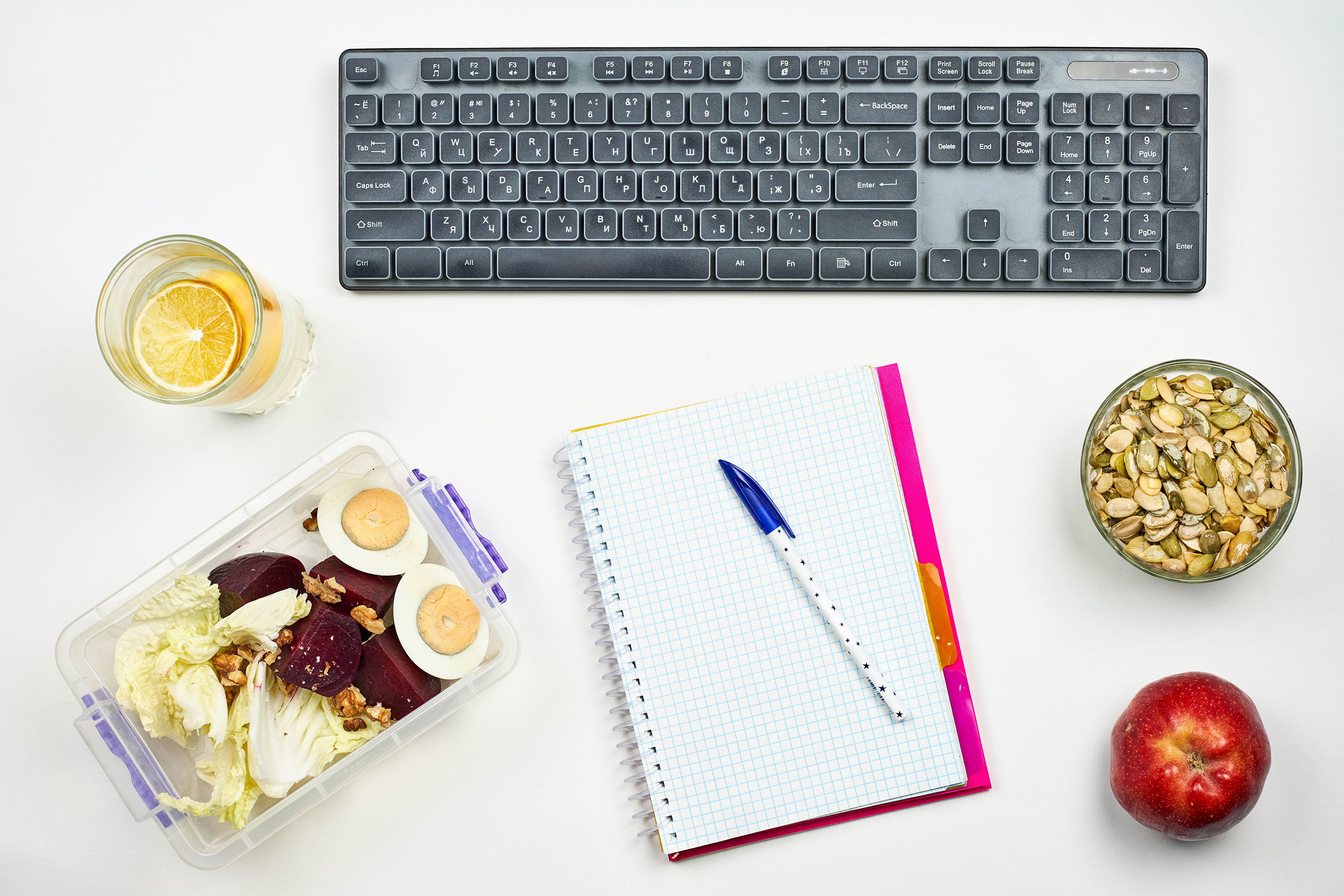 Keyboard, food, and notebook on white background HD Wallpaper