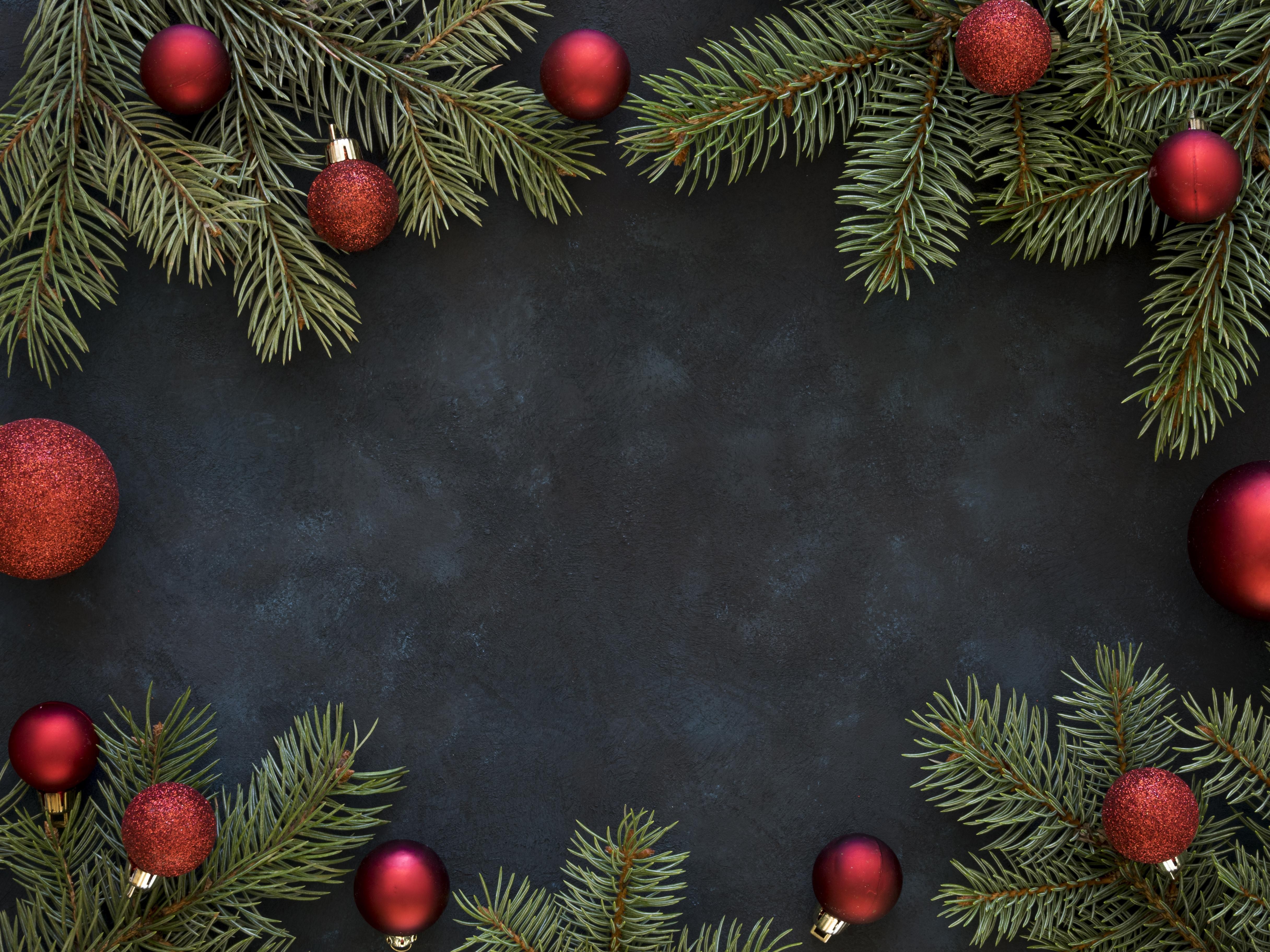 Christmas branches with red ornaments on dark background HD Wallpaper