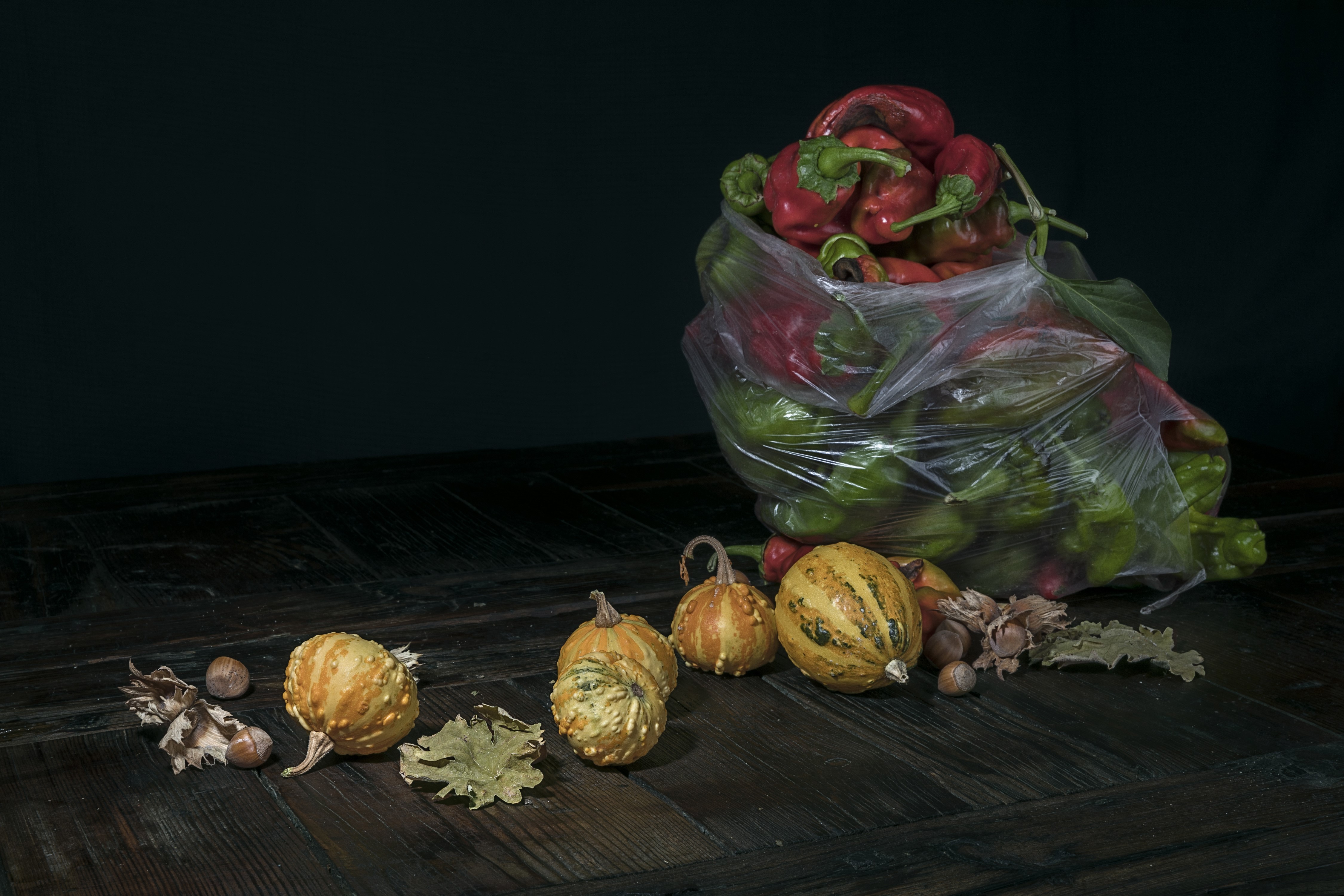 Bell peppers and pumpkins on a wooden table HD Wallpaper
