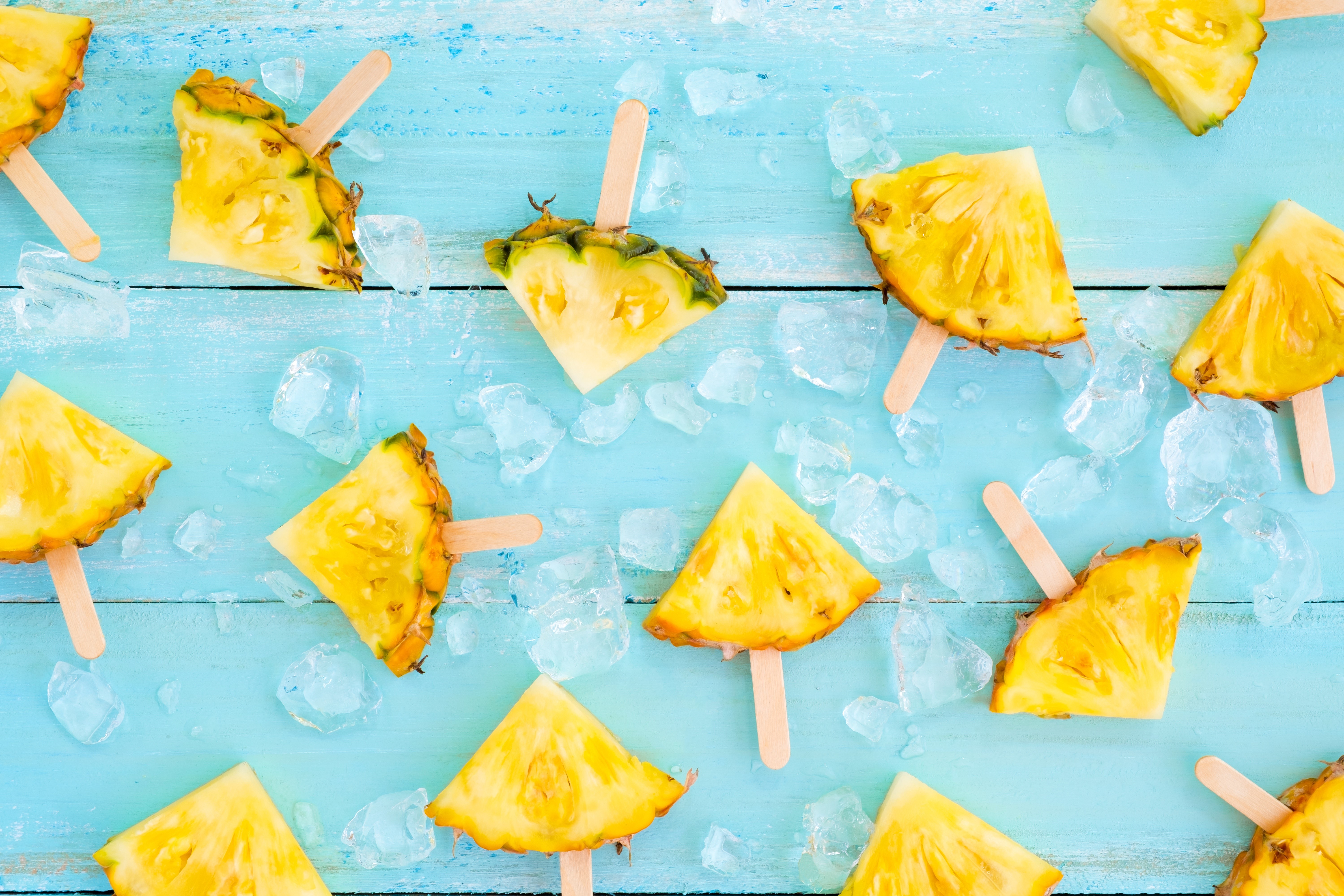 Pineapple slices on sticks with ice HD Wallpaper